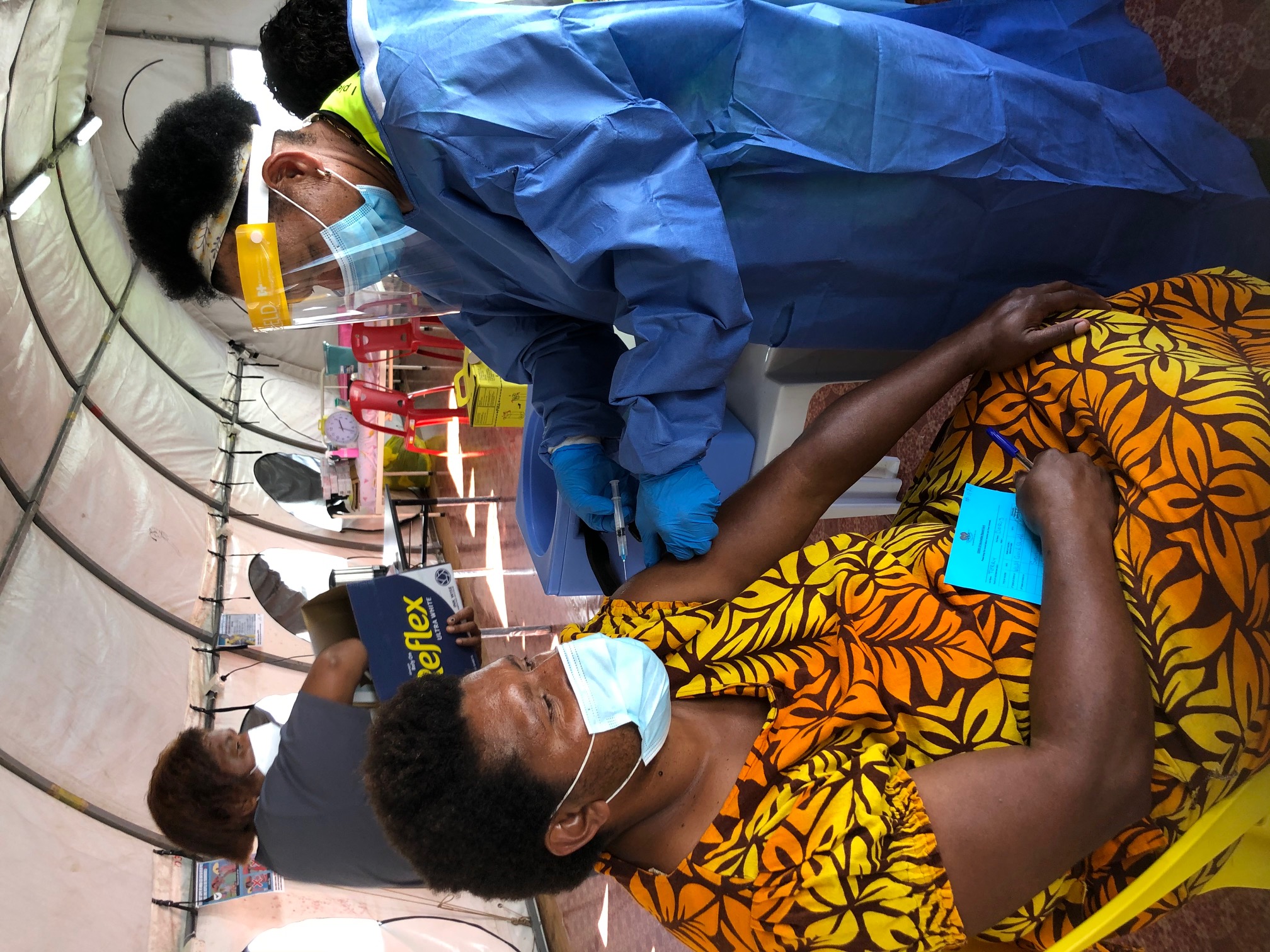 Western Highlands Health Service staff administer a COVID-19 vaccination in Mount Hagen