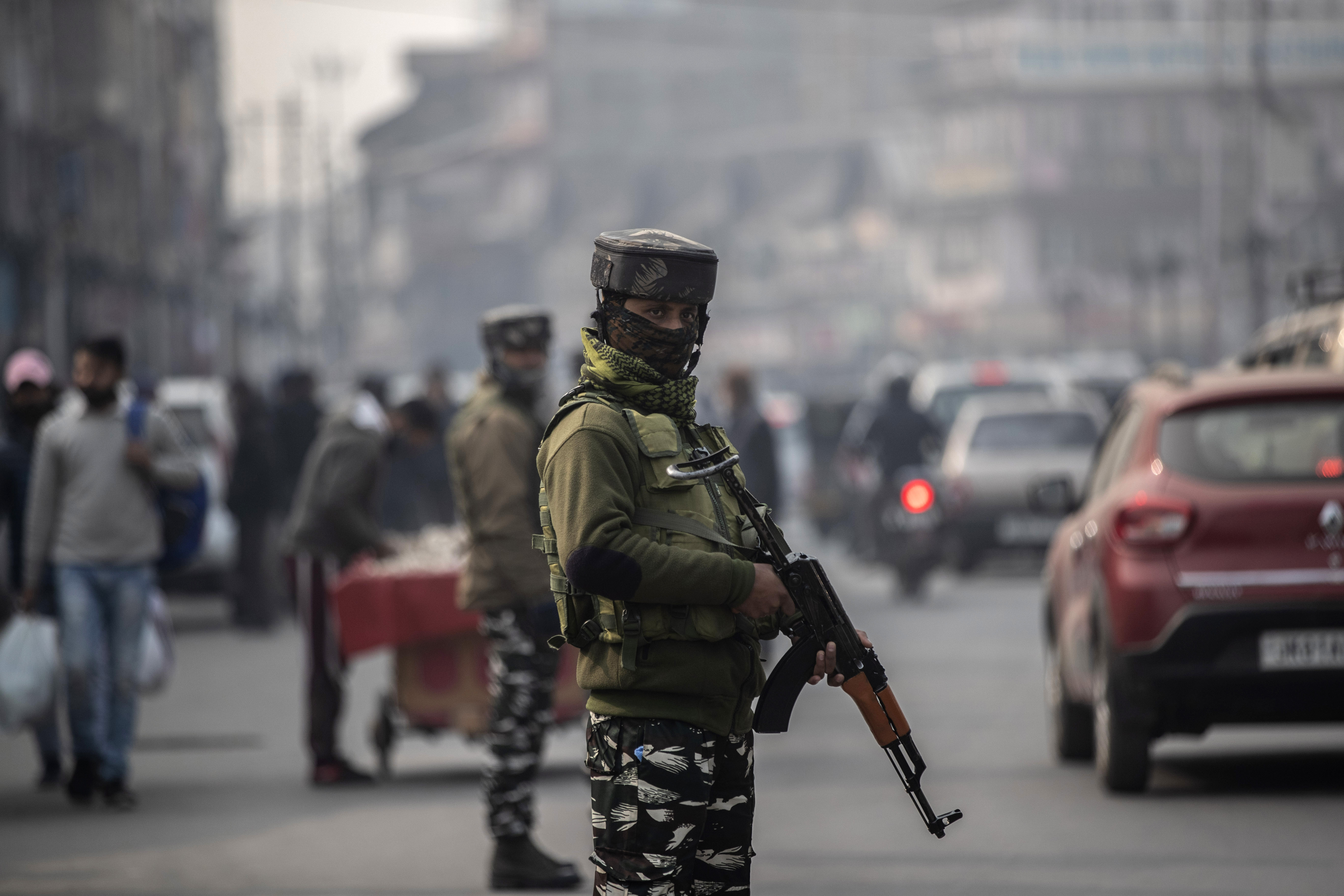 Indian paramilitary soldiers outside a market in Srinagar, Indian controlled Kashmir