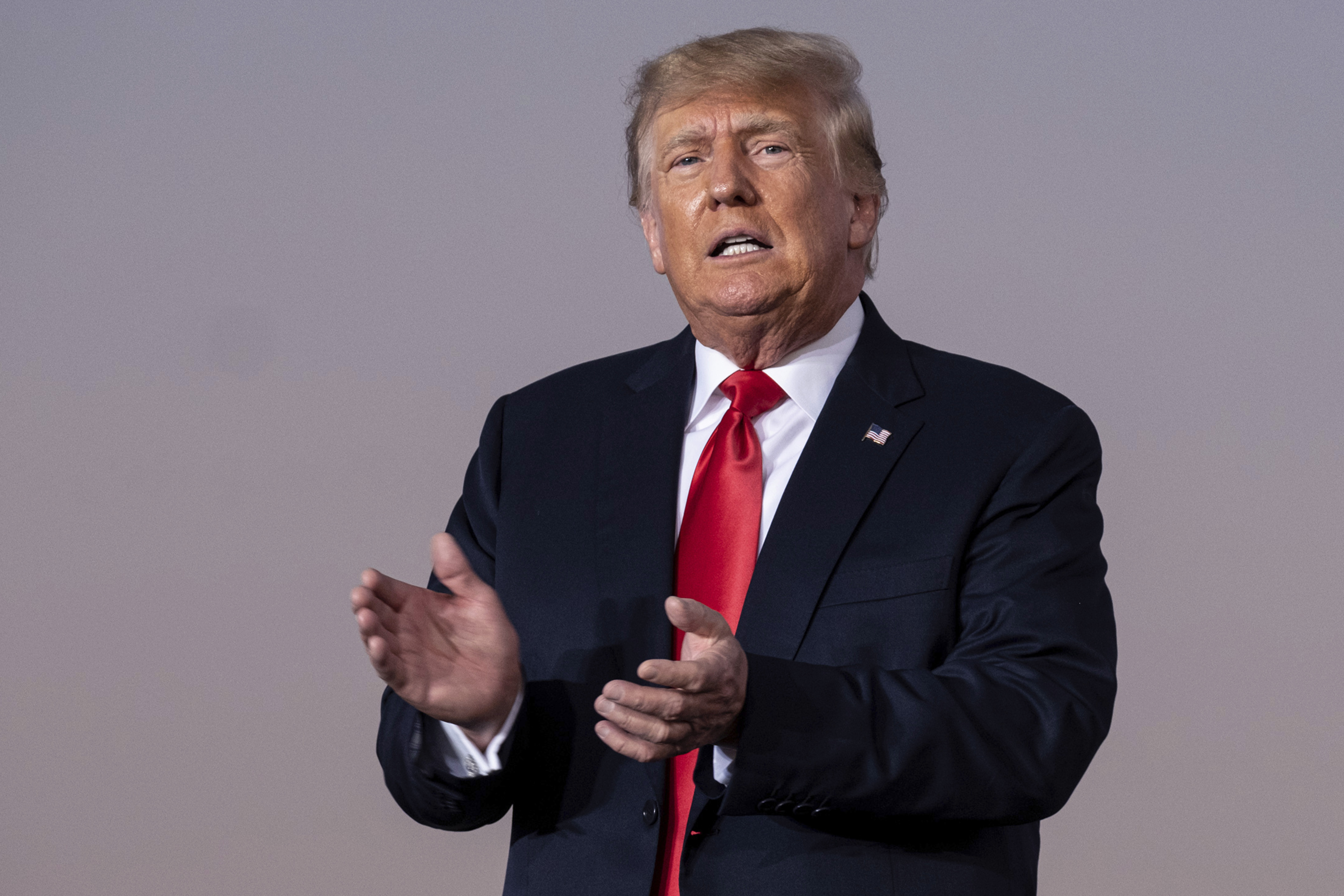 Former President Donald Trump prepares to take the stage during a rally in 2021