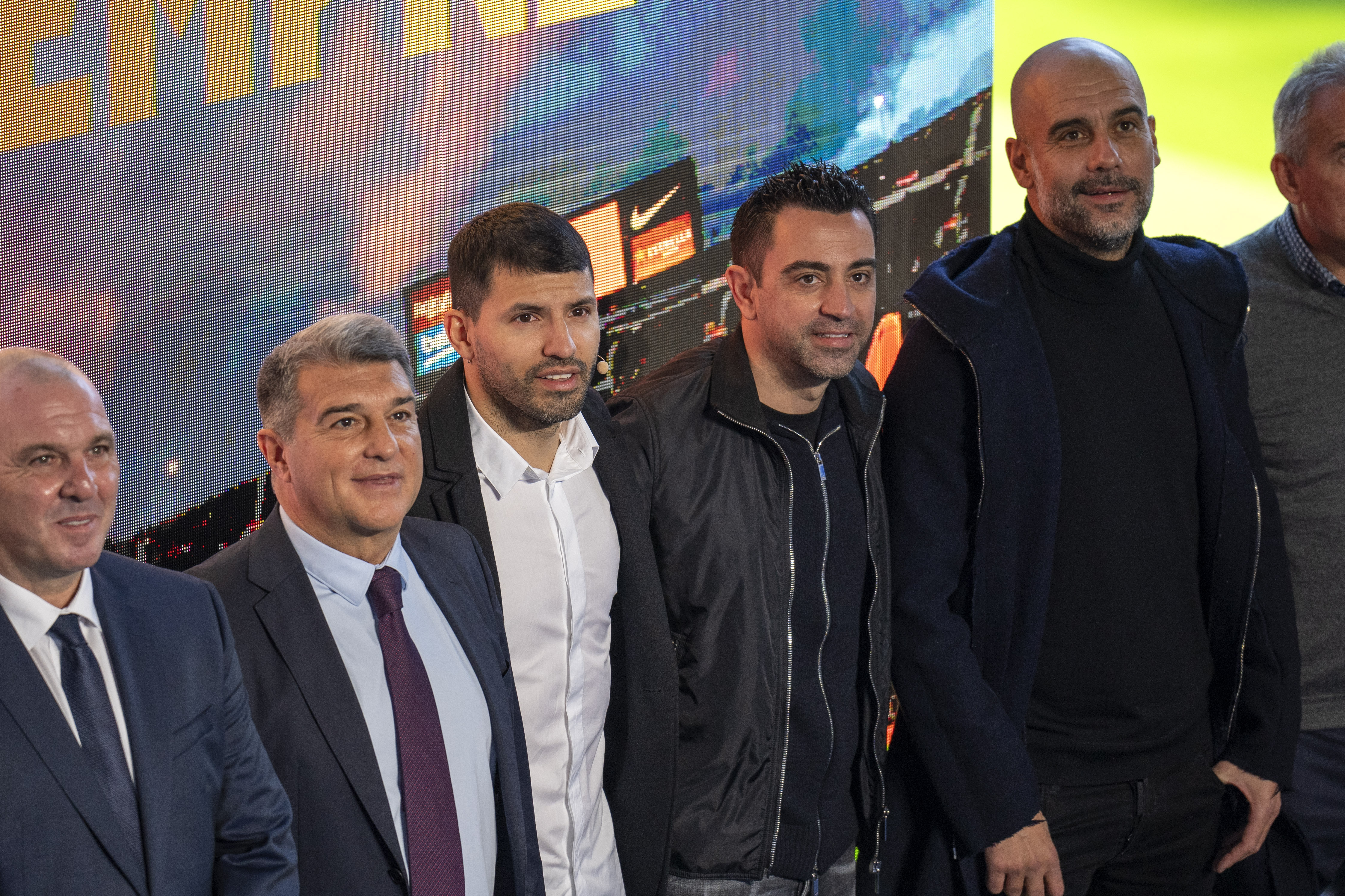 Barcelona striker Sergio Aguero poses for a photo with Barcelona president Joan Laporta, left, Manchester City’s head coach Pep Guardiola, right, and Barcelona’s head coach Xavi, centre, during a news conference at the Camp Nou stadium