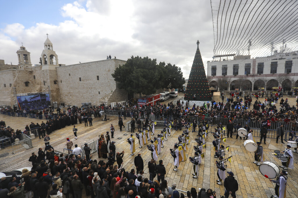 Palestinian scout bands parade through Manger Square at the Church of the Nativity, traditionally believed to be the birthplace of Jesus Christ