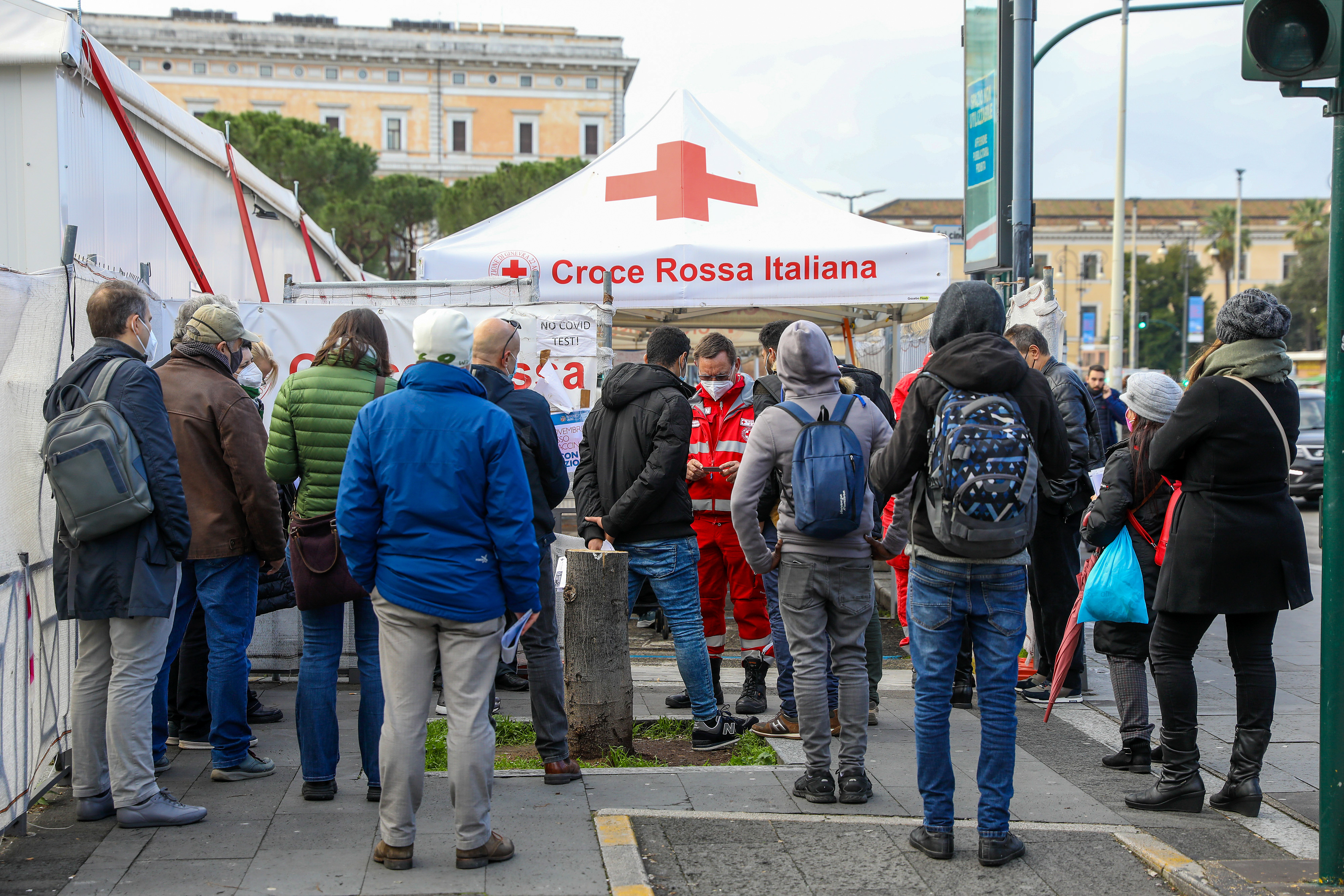 Visitors stand in line at a COVID-19 vaccination centre outside Rome’s Termini railway station in Rome, Italy
