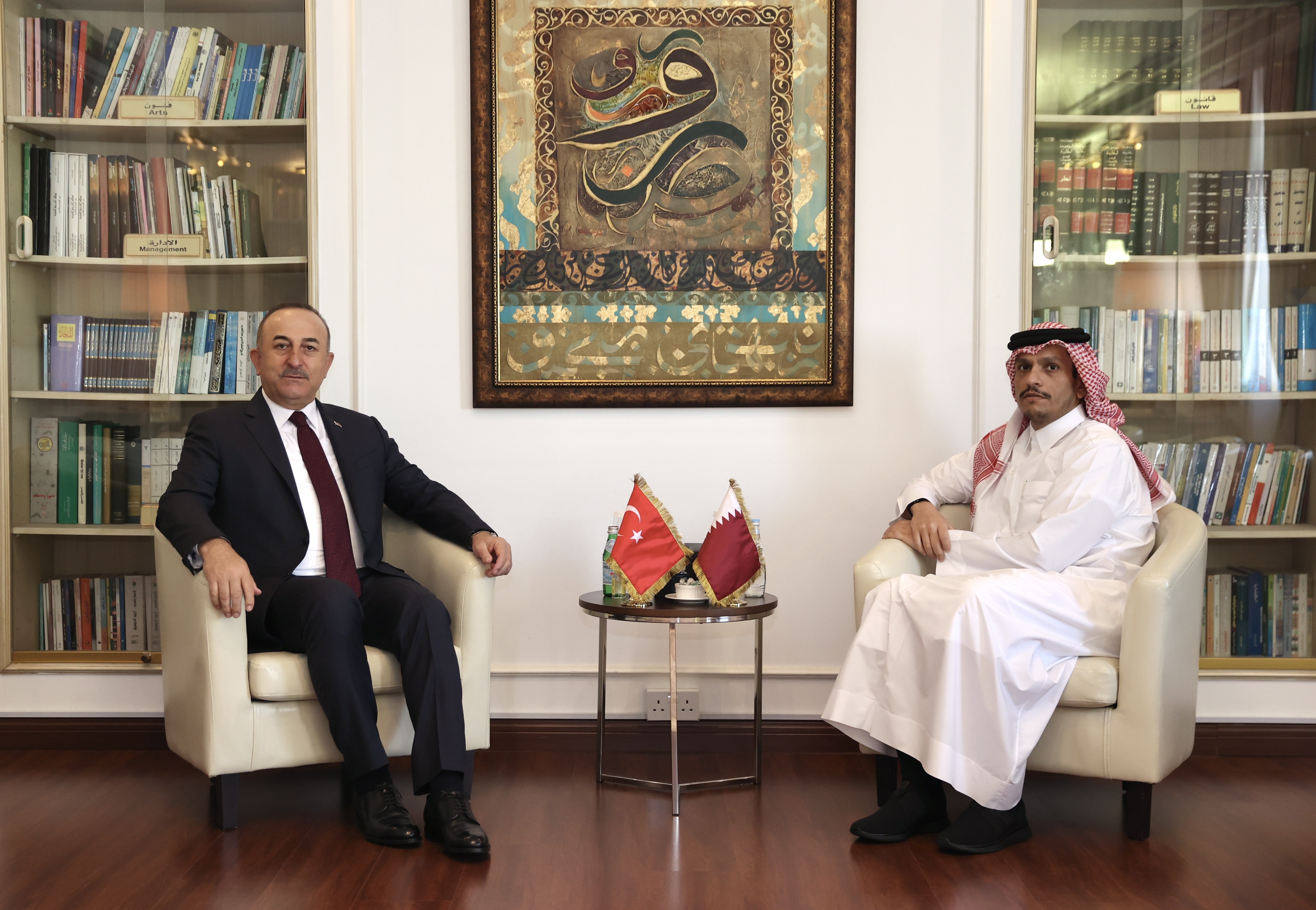 Cavusoglu, left, meets with Sheikh Mohammed, right, in Doha