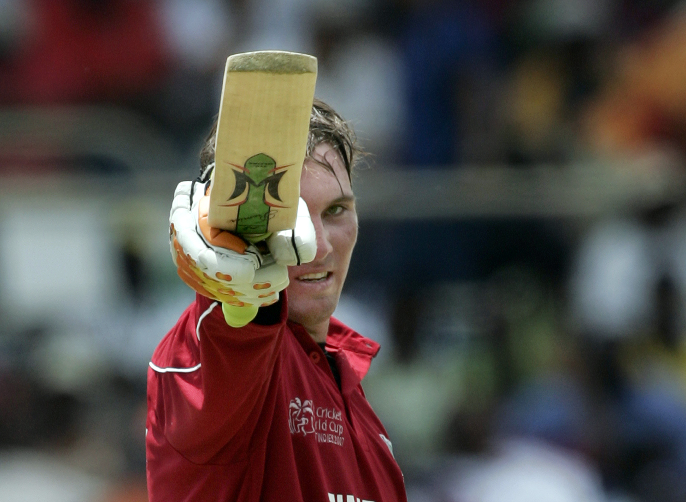Zimbabwe's Brendan Taylor raises his bat after scoring 50 runs against West Indies during their World Cup cricket match in Kingston March 19, 2007. MOBILES OUT, EDITORIAL USE ONLY REUTERS/Andy Clark (JAMAICA)