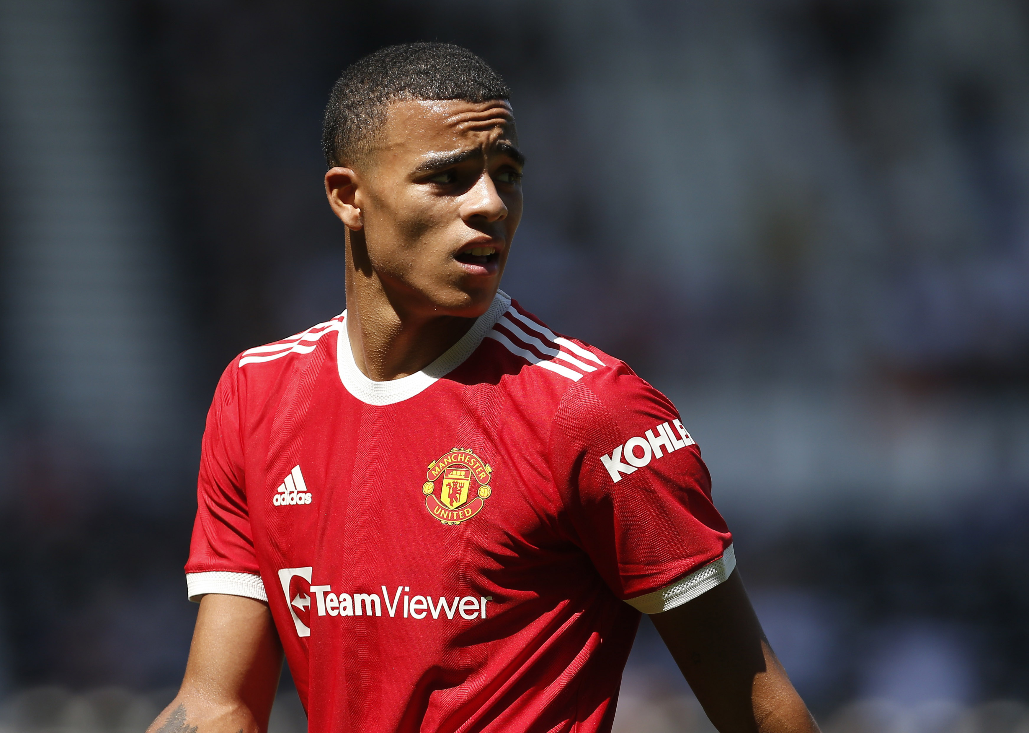 mason greenwood looks on during a football match