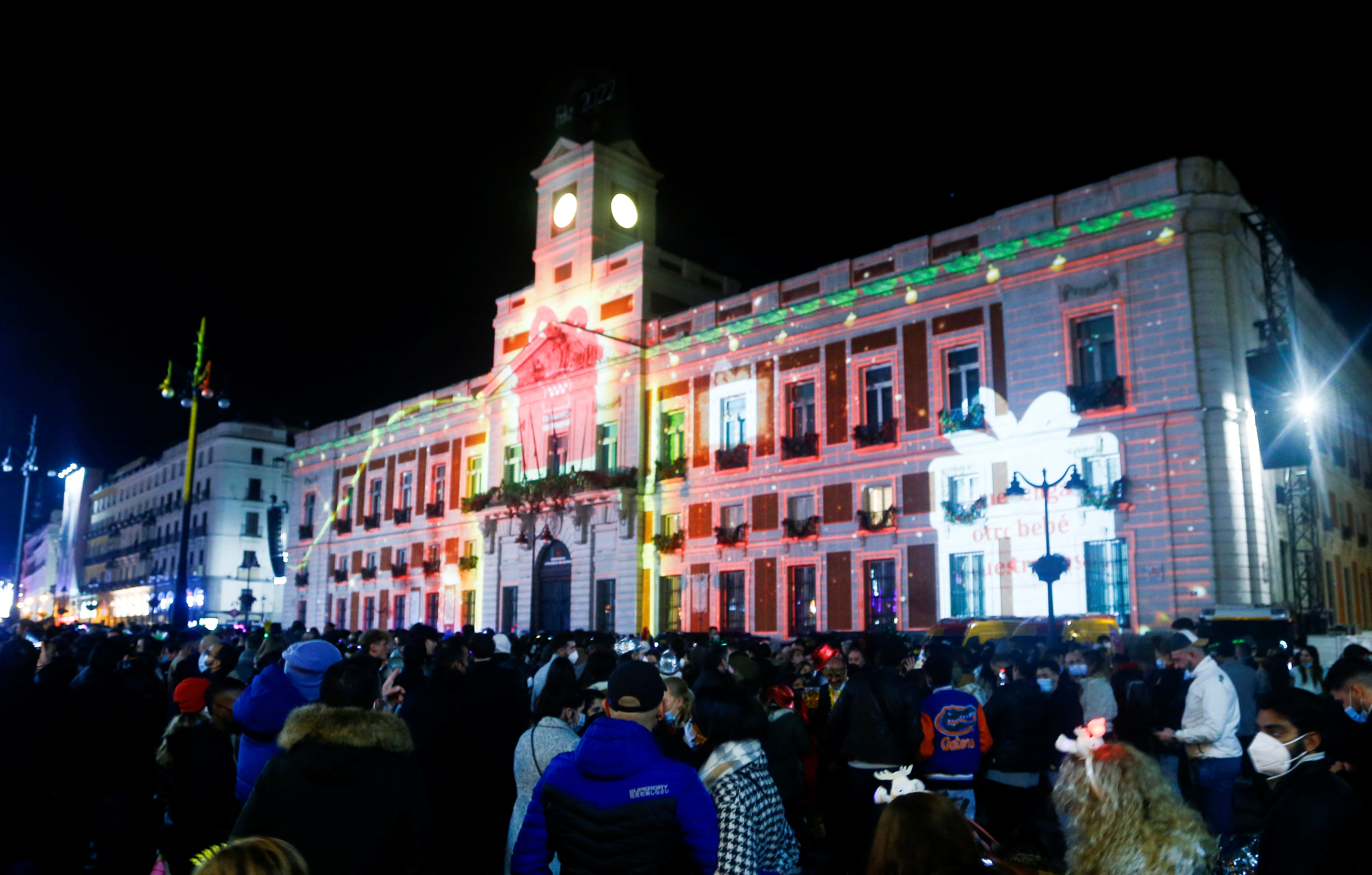 People gather at the Puerta del Sol square during New Year’s Eve celebrations in Madrid