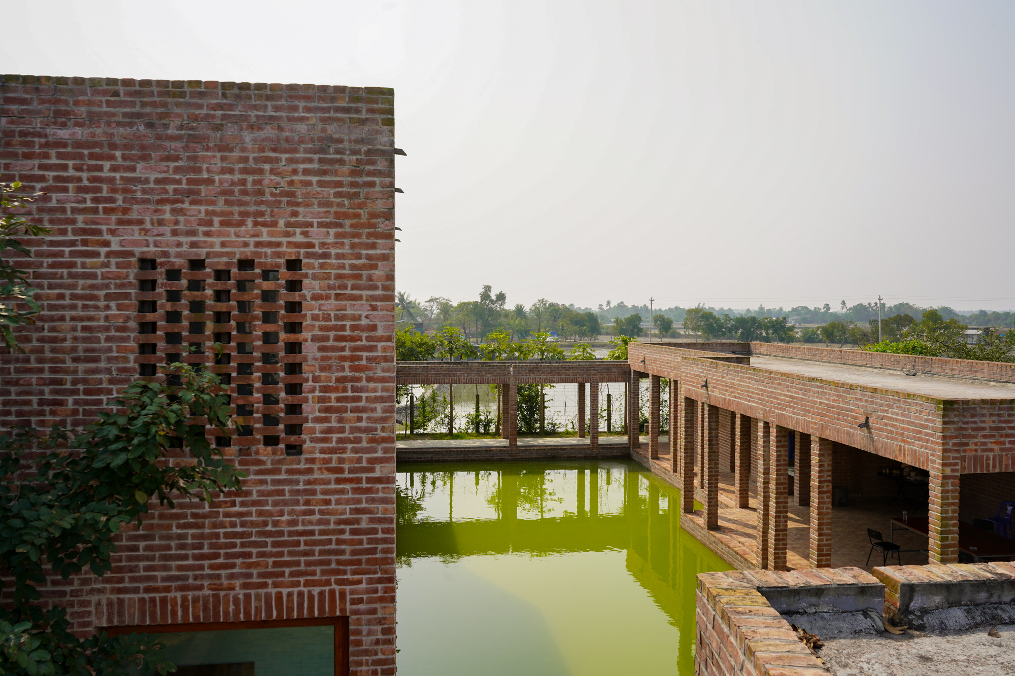 Rain Harvesting Canal crisis crossing insides the friendship hospital. The canals are designed for microclimatic cooling and work as a divider, in terms of zoning of the hospital
