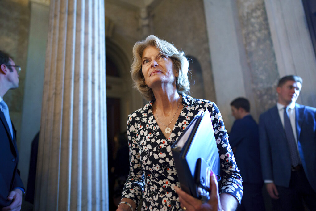 Sen. Lisa Murkowski, R-Alaska, walks to the chamber at the Capitol.