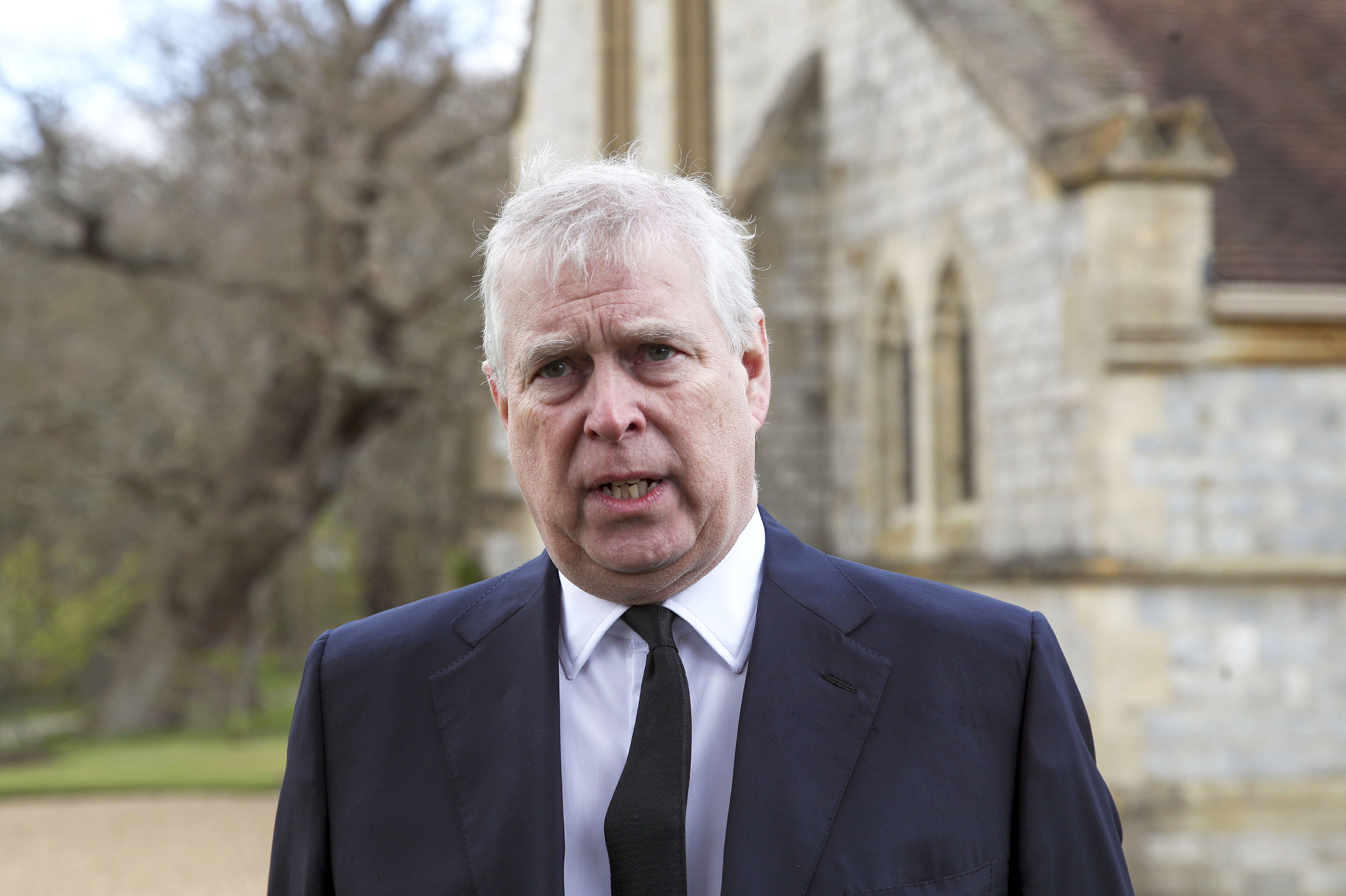 Prince Andrew stand outside the chapel at Royal Lodge in Windsor England
