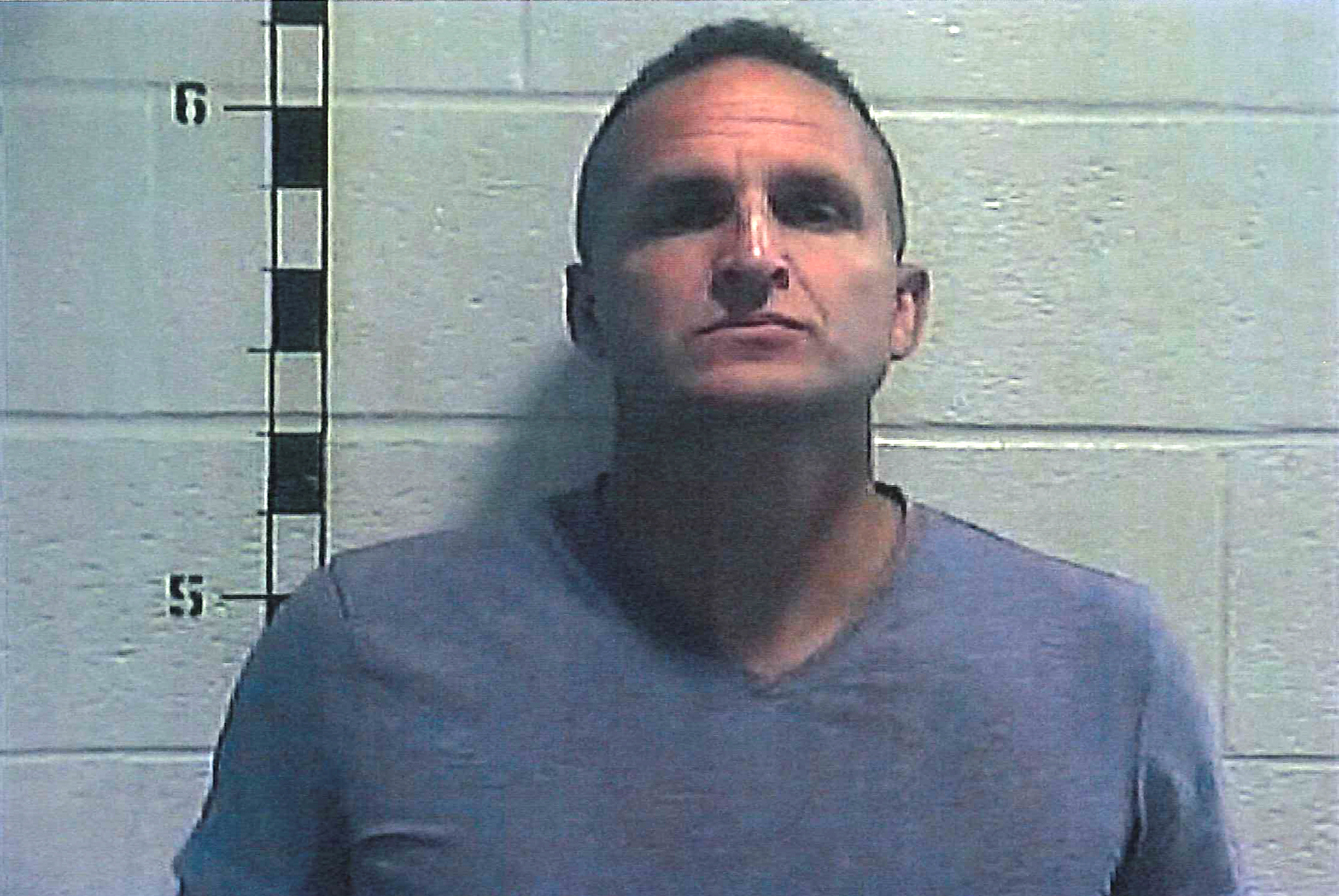 Former Louisville police detective Brett Hankison poses for a booking photograph at Shelby County Detention Center in Shelbyville, Kentucky.