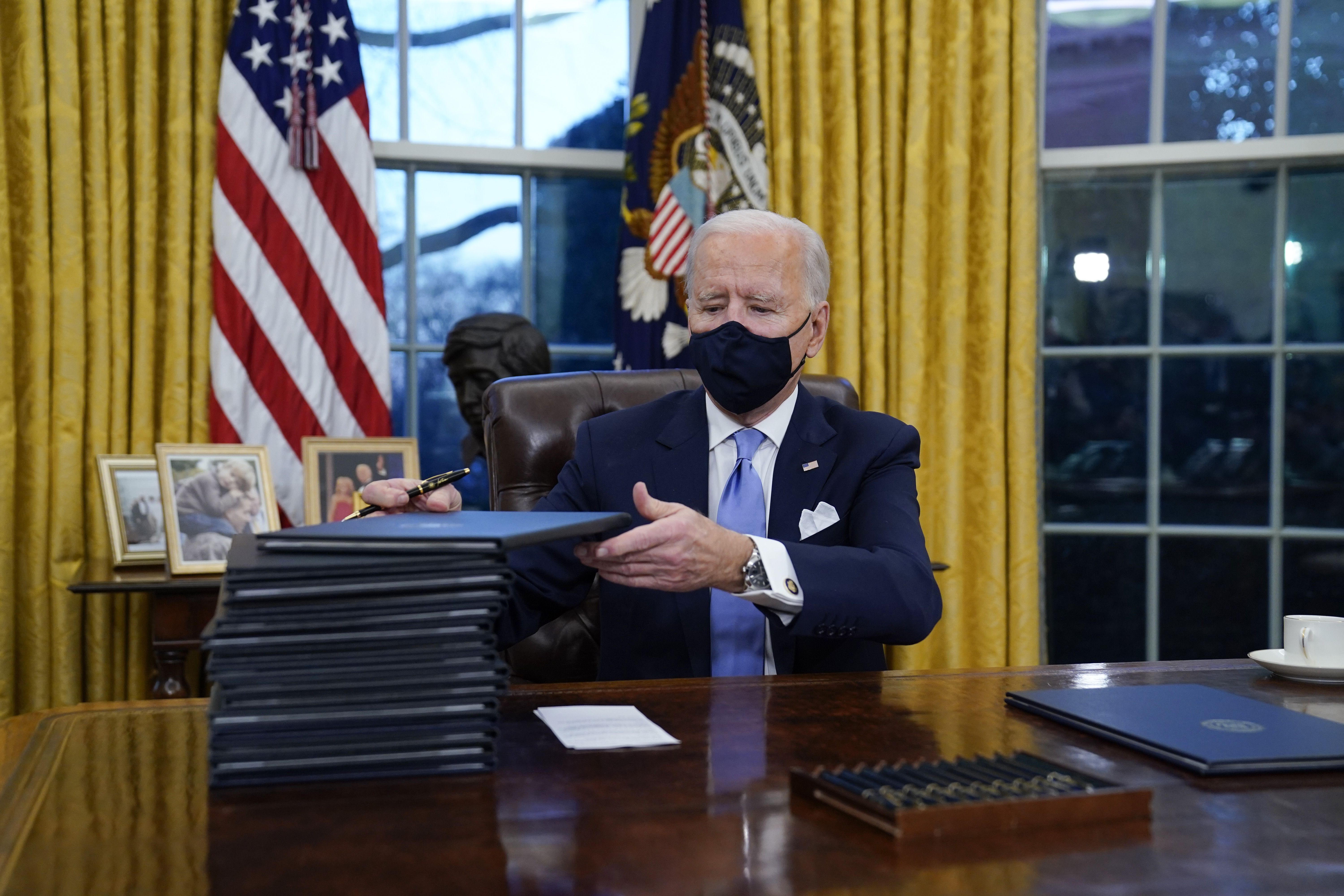 Joe Biden signing executive orders