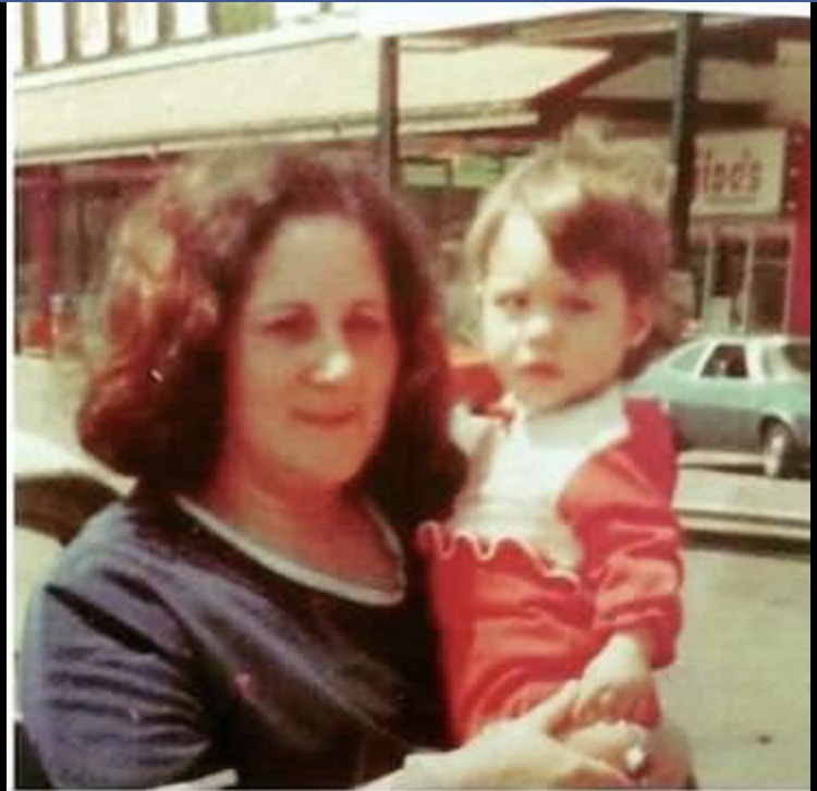 A photo of a woman holding a baby.