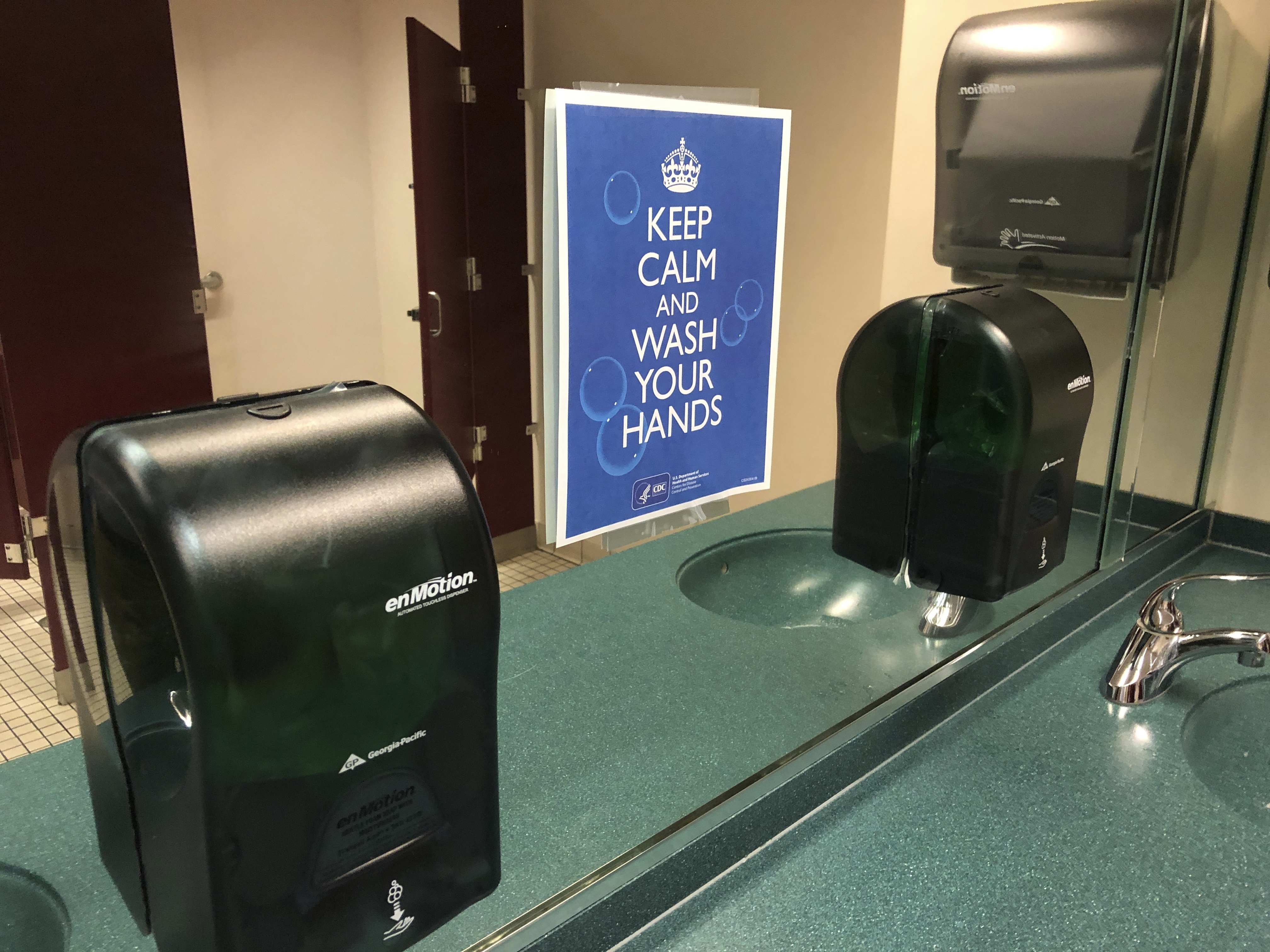 A sign advises hand-washing in a bathroom at St. Philip African Methodist Episcopal Church in Atlanta on Sunday, March 15, 2020. Only about 100 people filled a sprawling sanctuary that seats more than a thousand at the church because of coronavirus fears. Pastor William Watley told congregants he would follow officials' guidance on whether to continue services after Sunday, calling for prayer during the epidemic