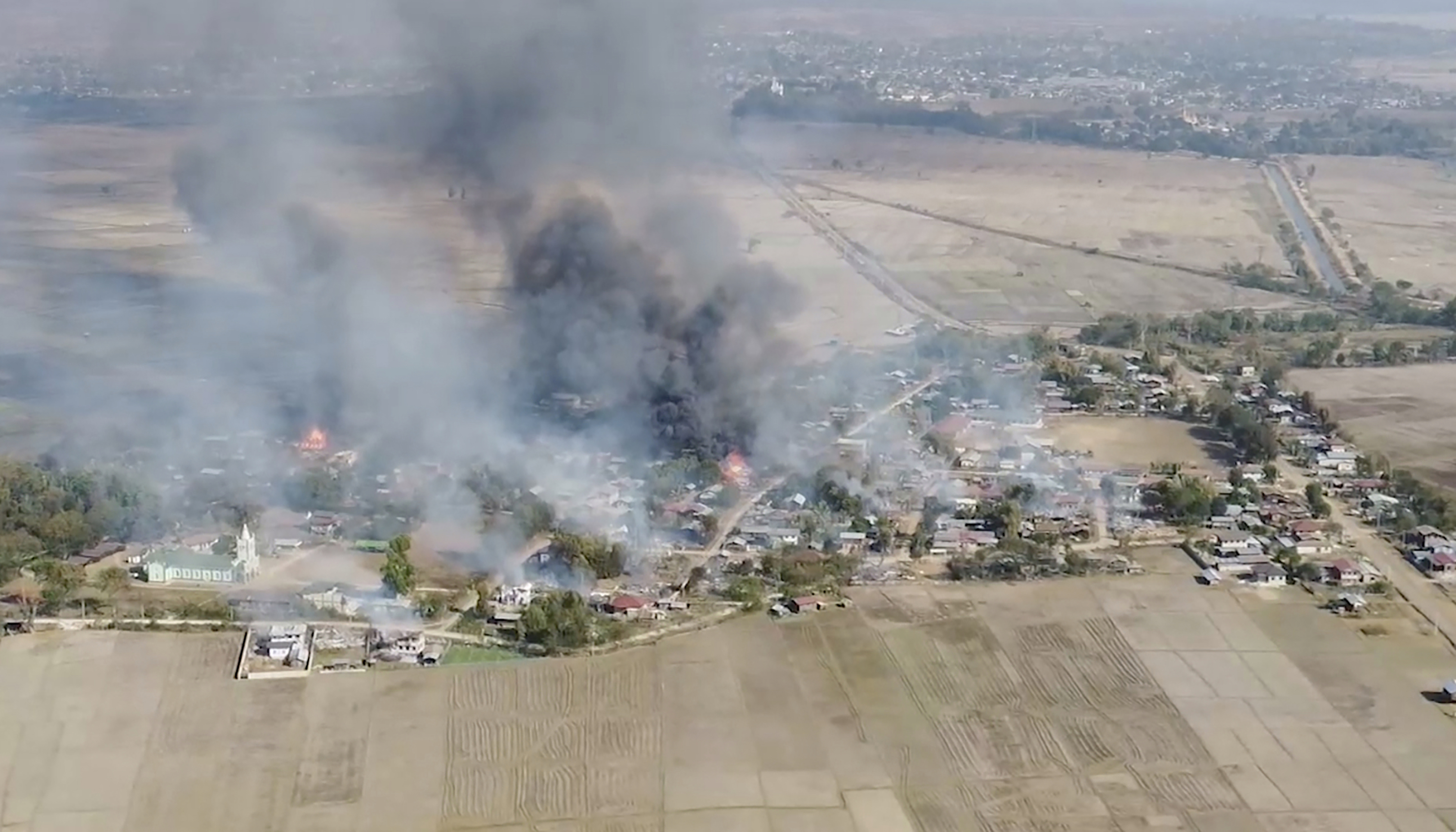 Smoke rises from a village in Myanmar's Kayah State after it was bombed by the military.