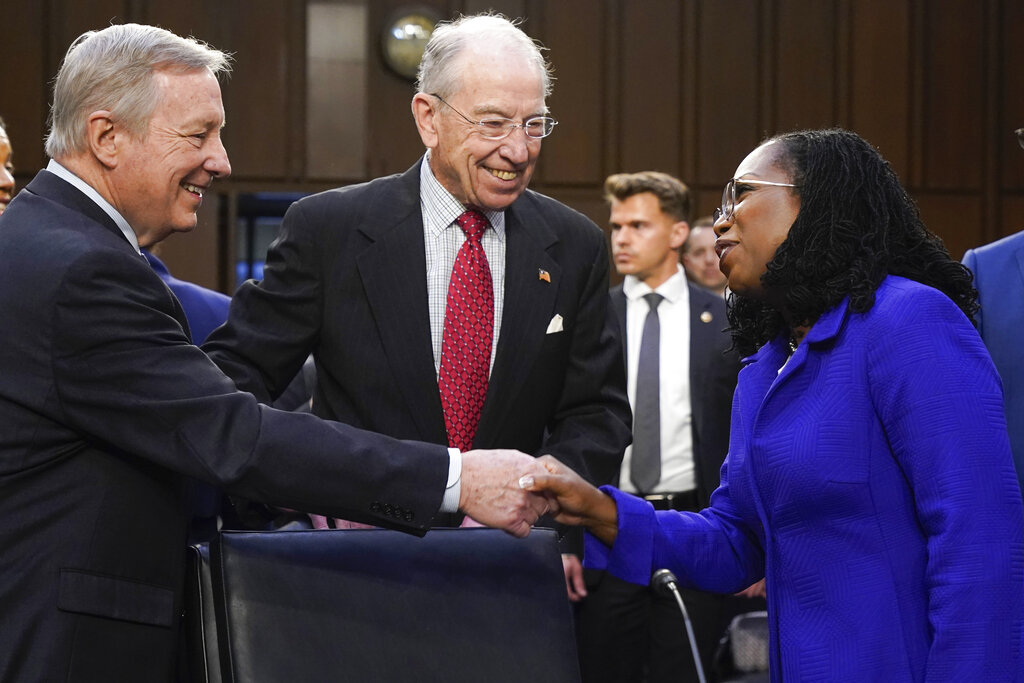 Supreme Court nominee Judge Ketanji Brown Jackson greets Senator Dick Durbin, chairman of the Senate Judiciary Committee, and Senator Chuck Grassley, the top Republican on the committee.