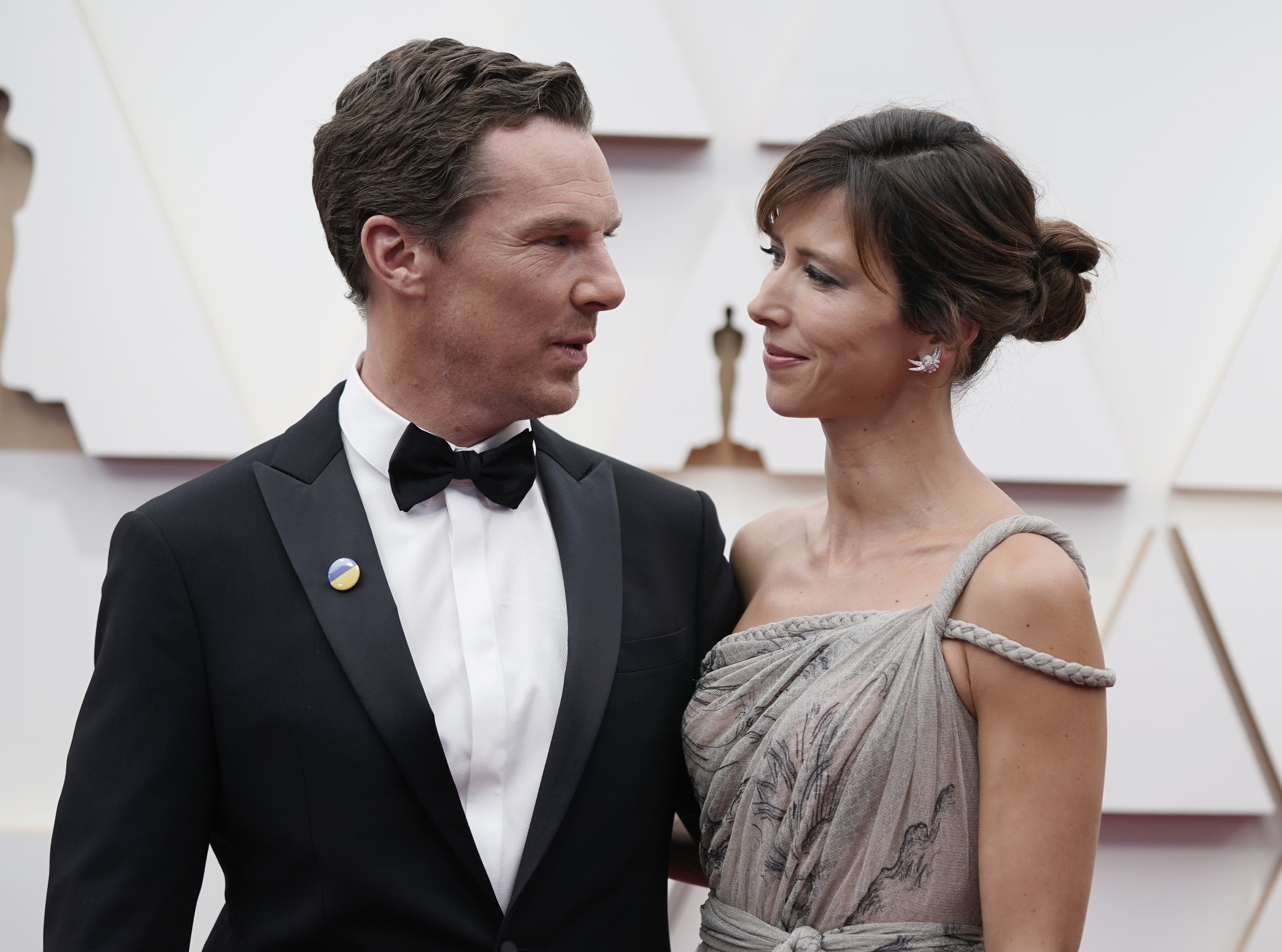Benedict Cumberbatch, left, and Sophie Hunter arrive at the Oscars on Sunday, March 27, 2022, at the Dolby Theatre in Los Angeles.