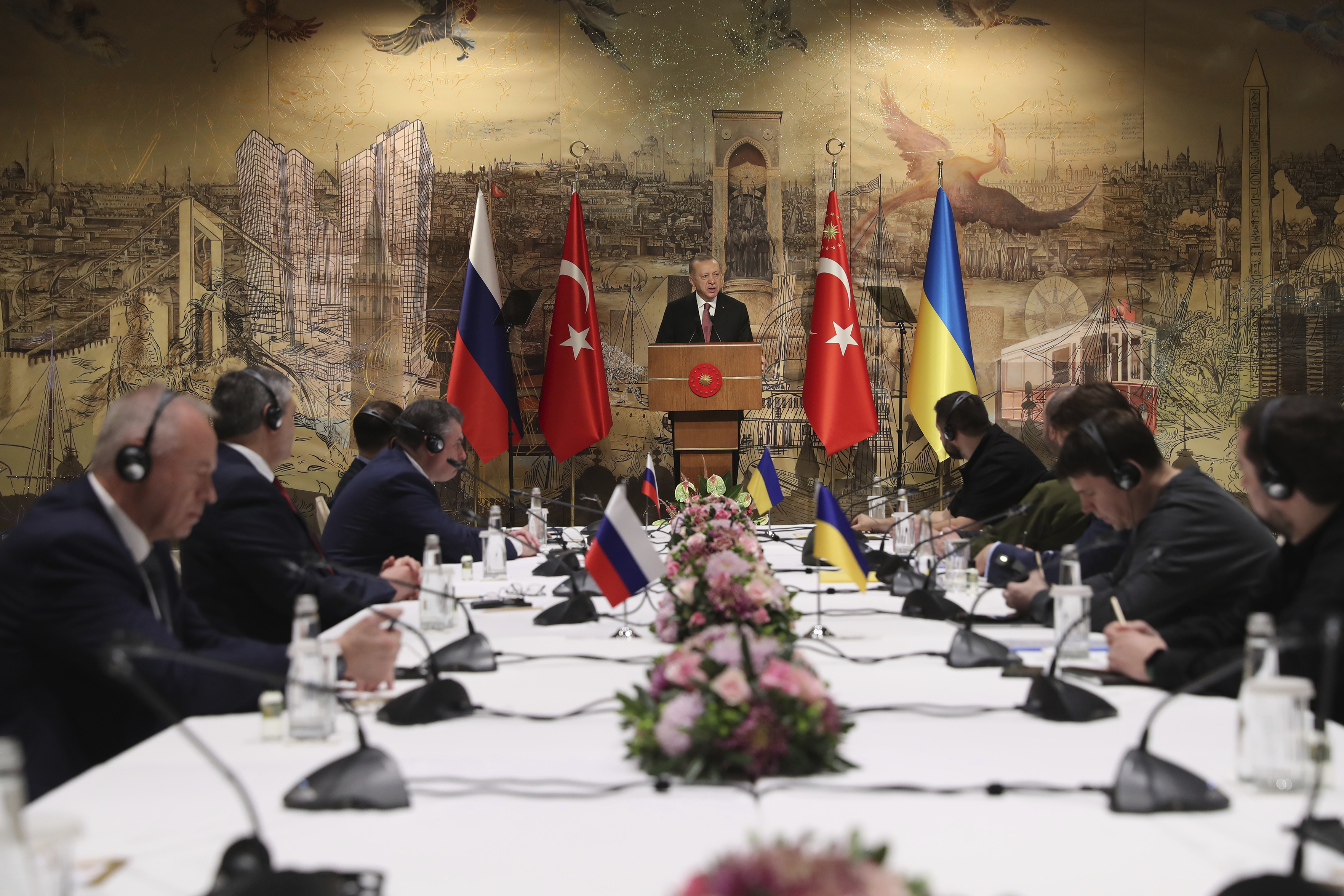 Turkish President Recep Tayyip Erdogan gives a speech to negotiating delegations on Tuesday [Turkish Presidency via AP]