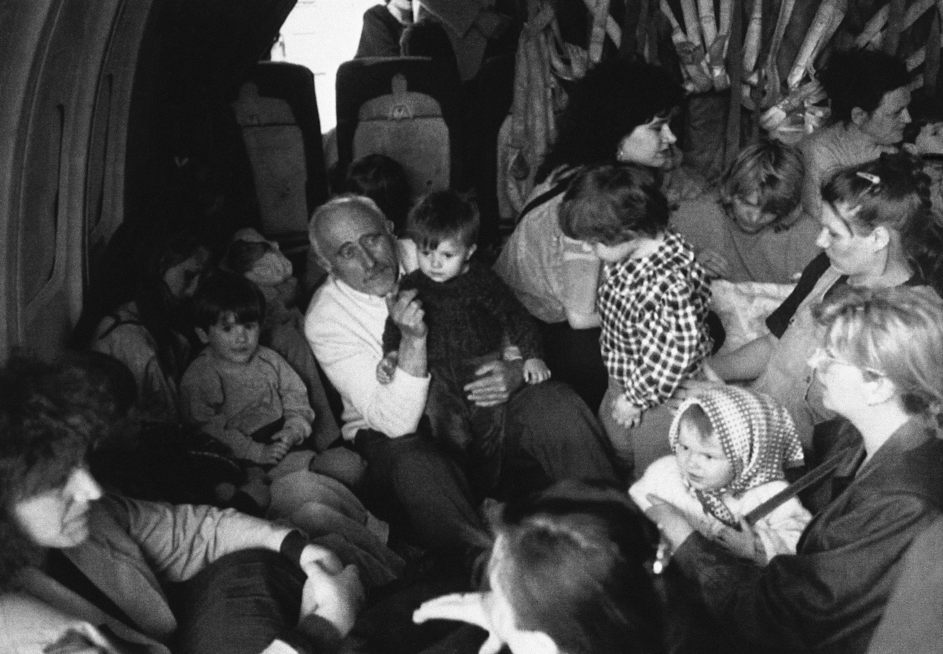 Refugees settle on board a Yugoslav air force plane in Sarajevo before leaving for Belgrade, May 1, 1992 [AP Photo]