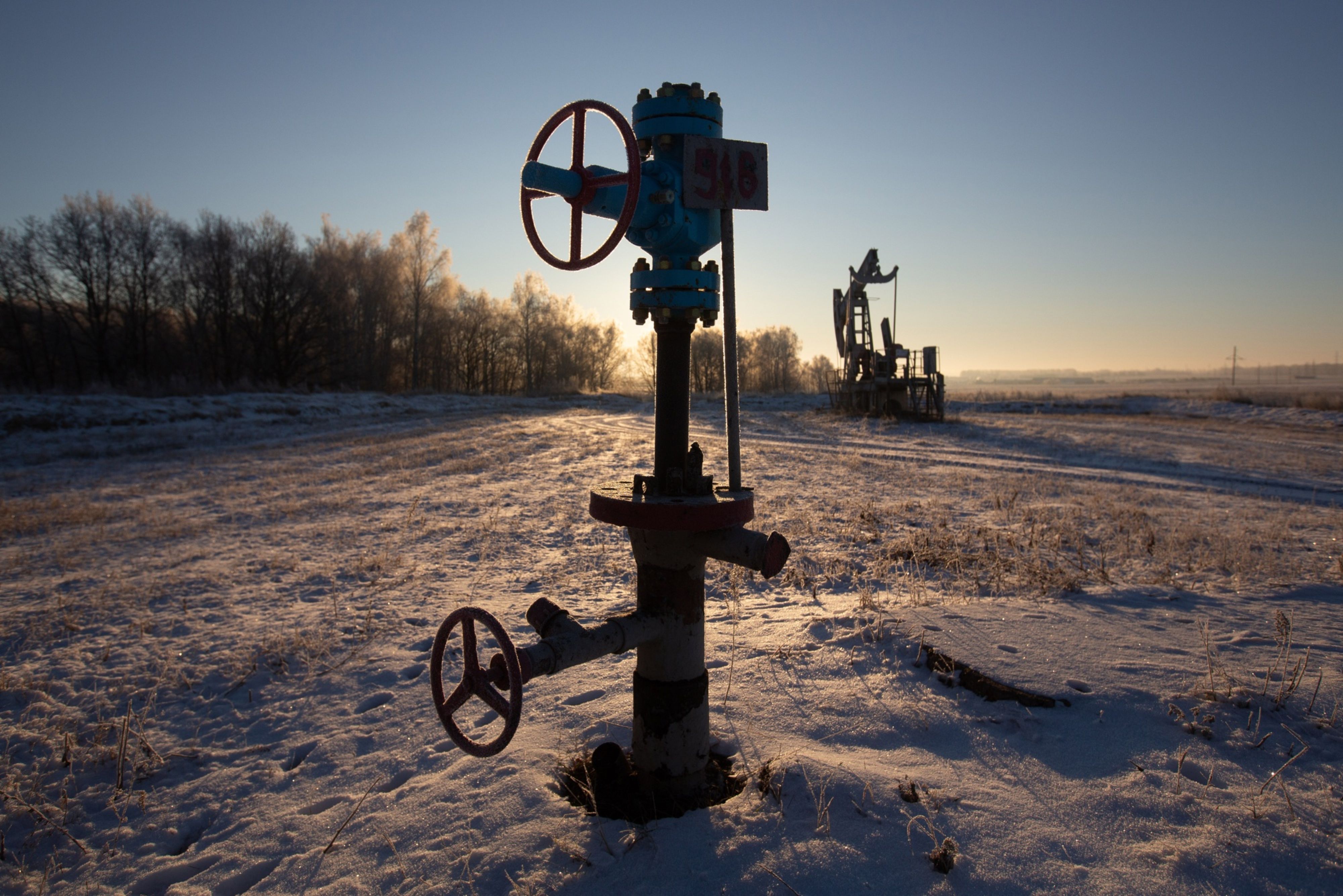 Valve control wheels connected to crude oil pipework in an oilfield near Dyurtyuli, in the Republic of Bashkortostan, Russia
