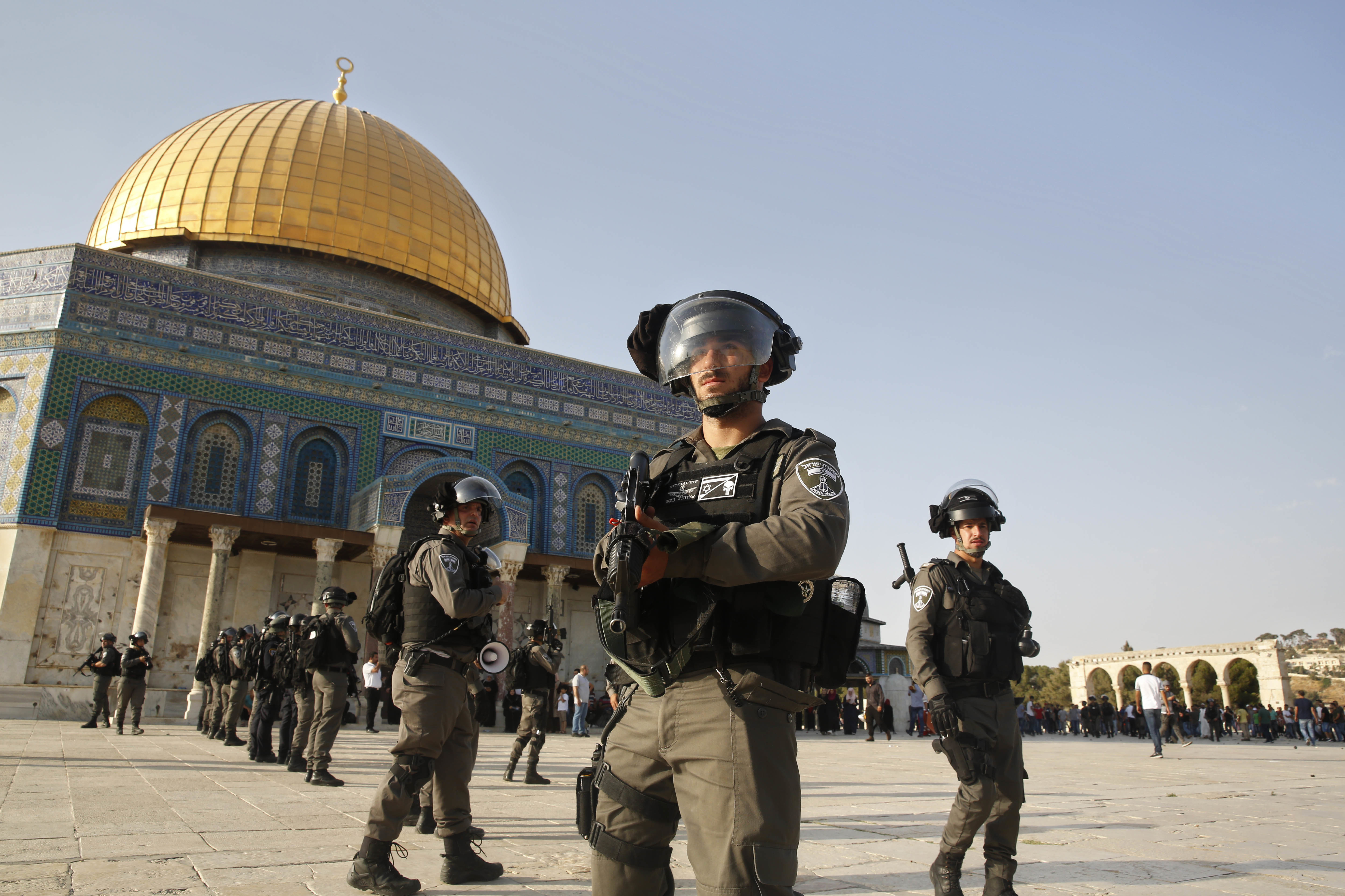 Israeli border police officers stand next to the Al Aqsa Mosque compound
