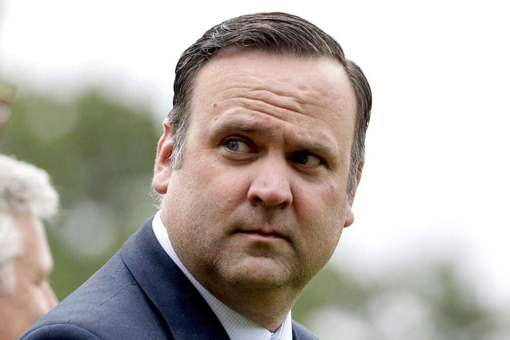 White House Social Media Director Dan Scavino walks across the South Lawn of the White House to board Marine One in Washington.