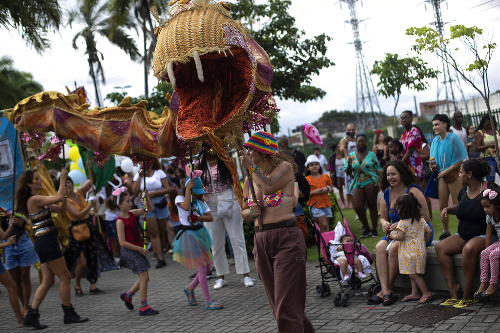 Revelers dance in the "Cordão do Boitata" parade in Rio de Janeiro.