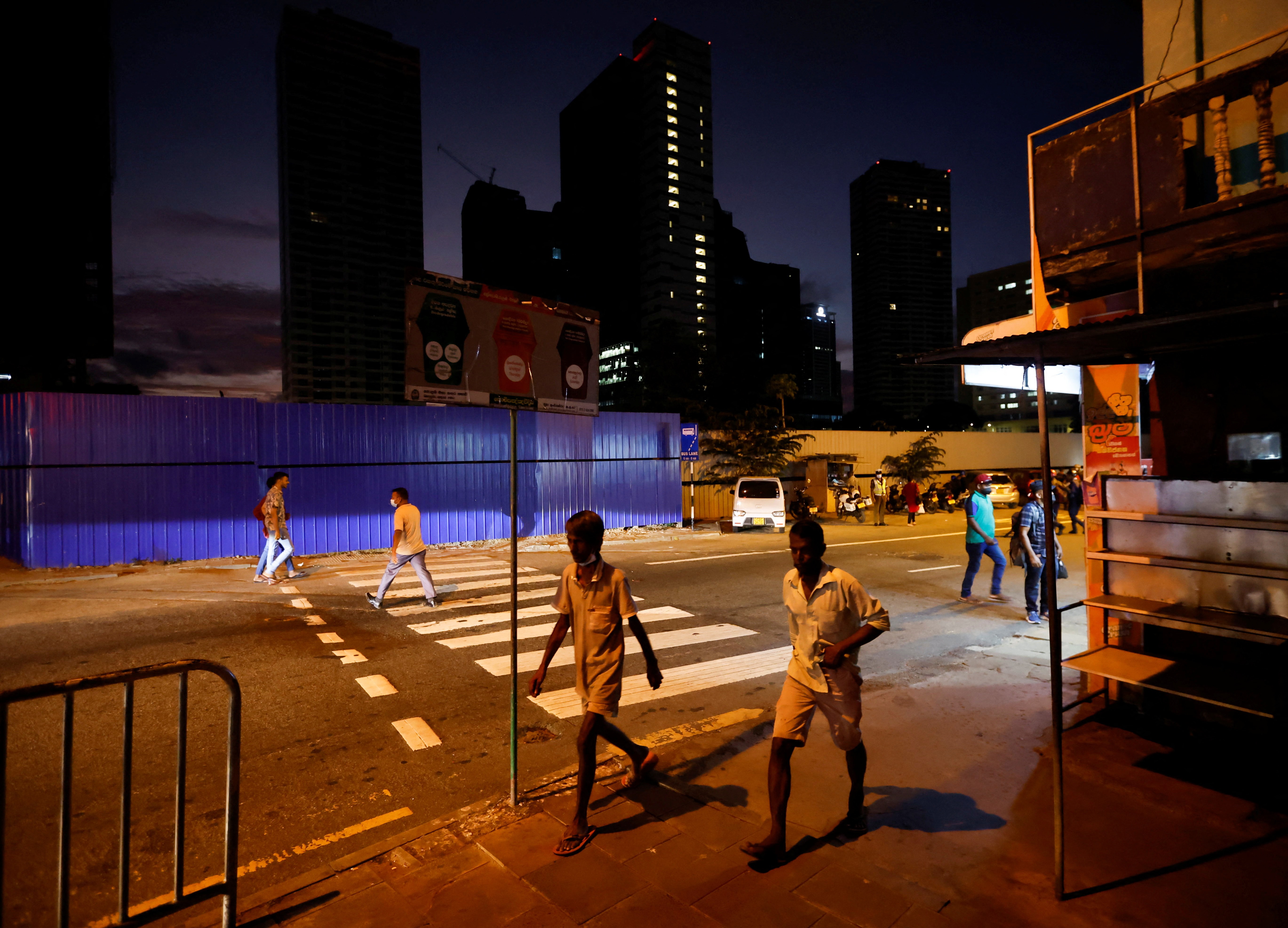 People walk on the streets of Slave Island, amid the country's economic crisis, in Colombo, Sri Lanka