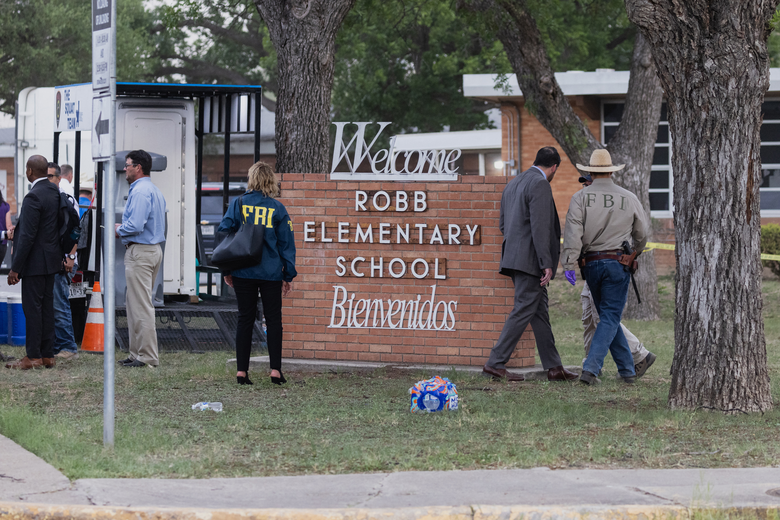 Law enforcement work the scene after a mass shooting at Robb Elementary School
