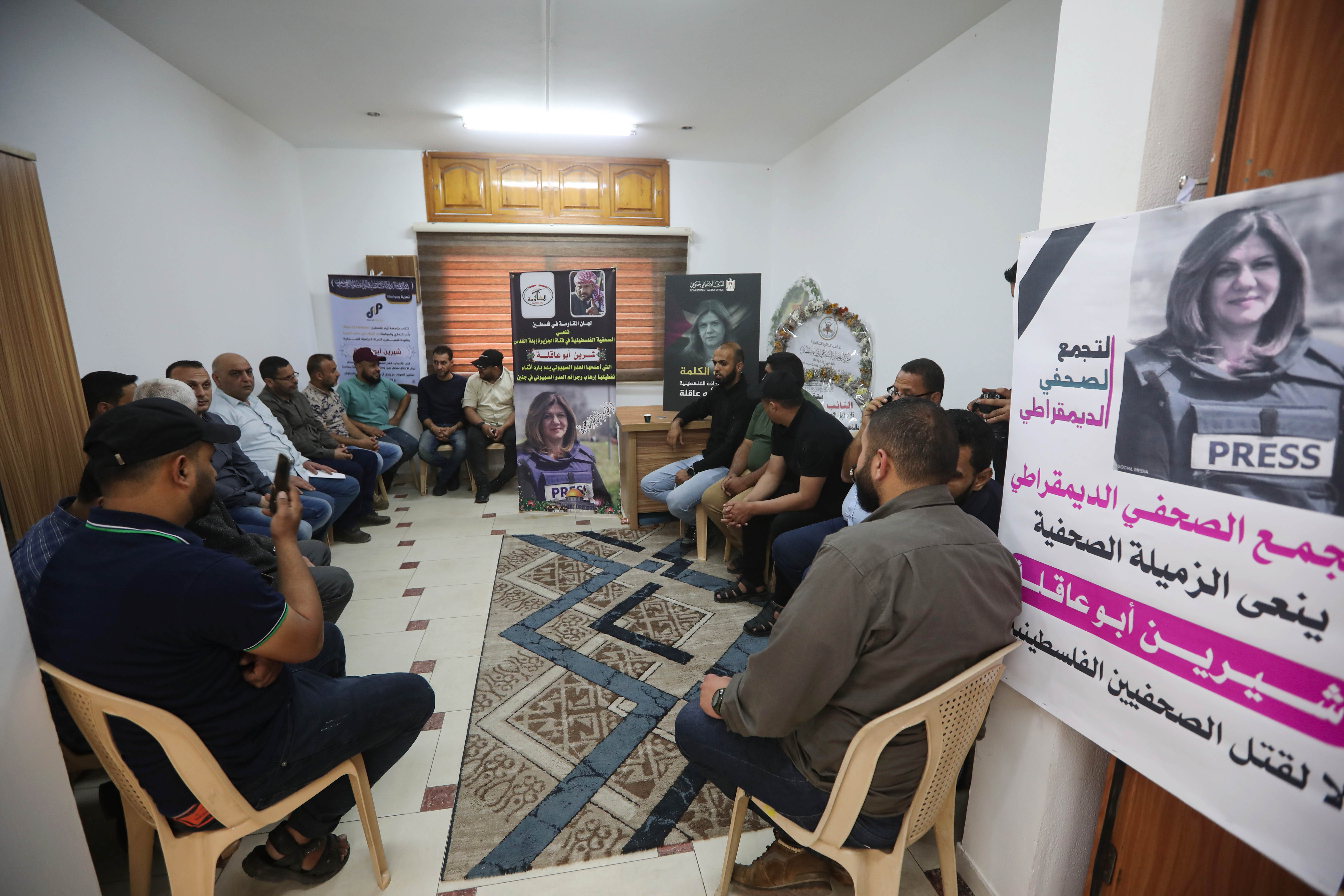 People offer condolences at Al Jazeera bureau in Gaza.