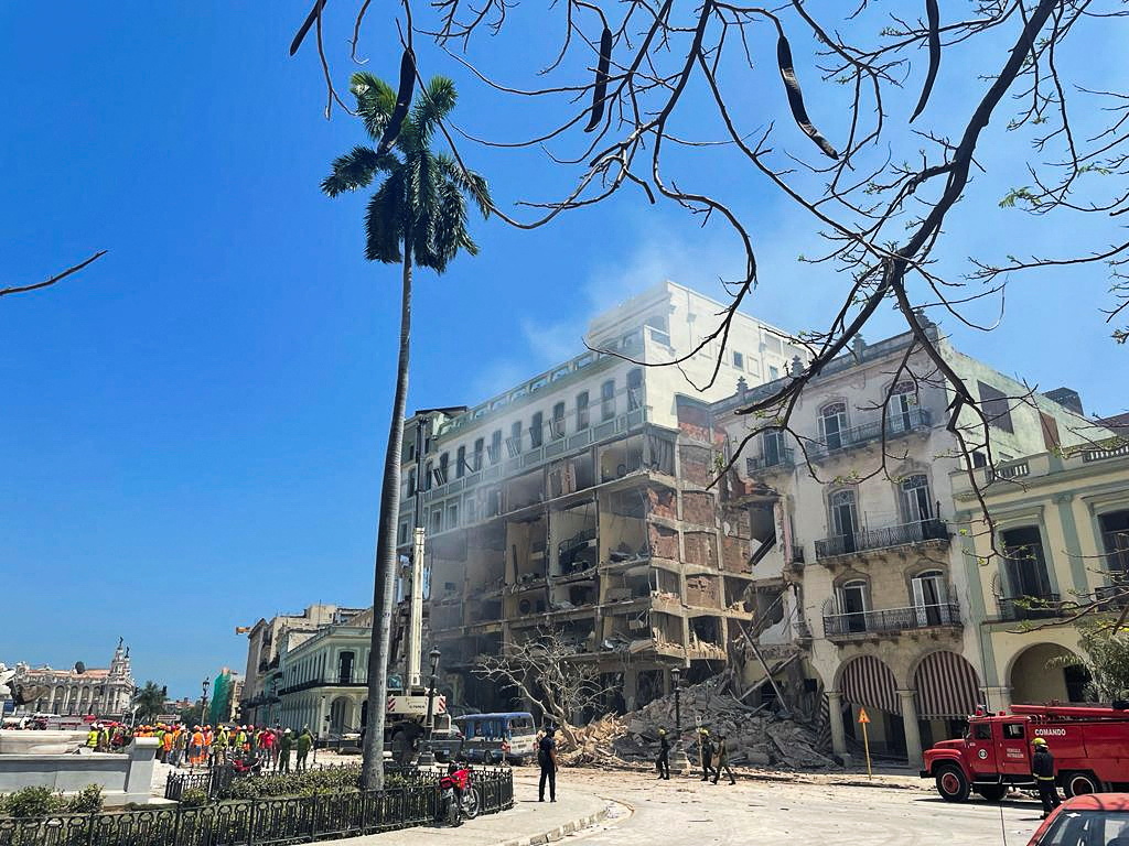 rescue teams work at site of an explosion at a hotel in Havana