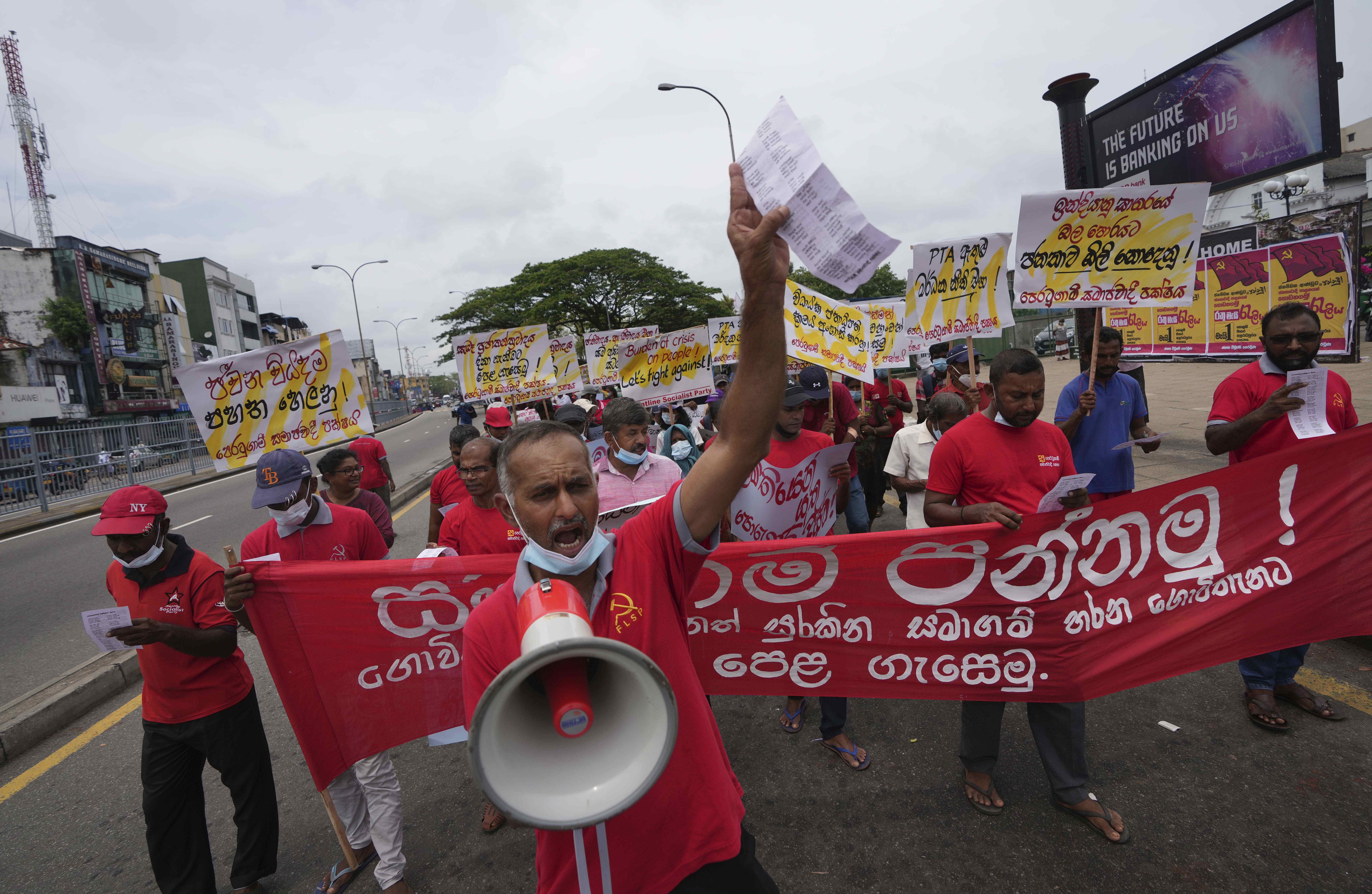 Sri Lanka's Frontline Socialist Party members attend a march to mark International Worker's Day in Colombo, Sri Lanka, Sunday, May 1, 2022 [Eranga Jayawardena/AP]