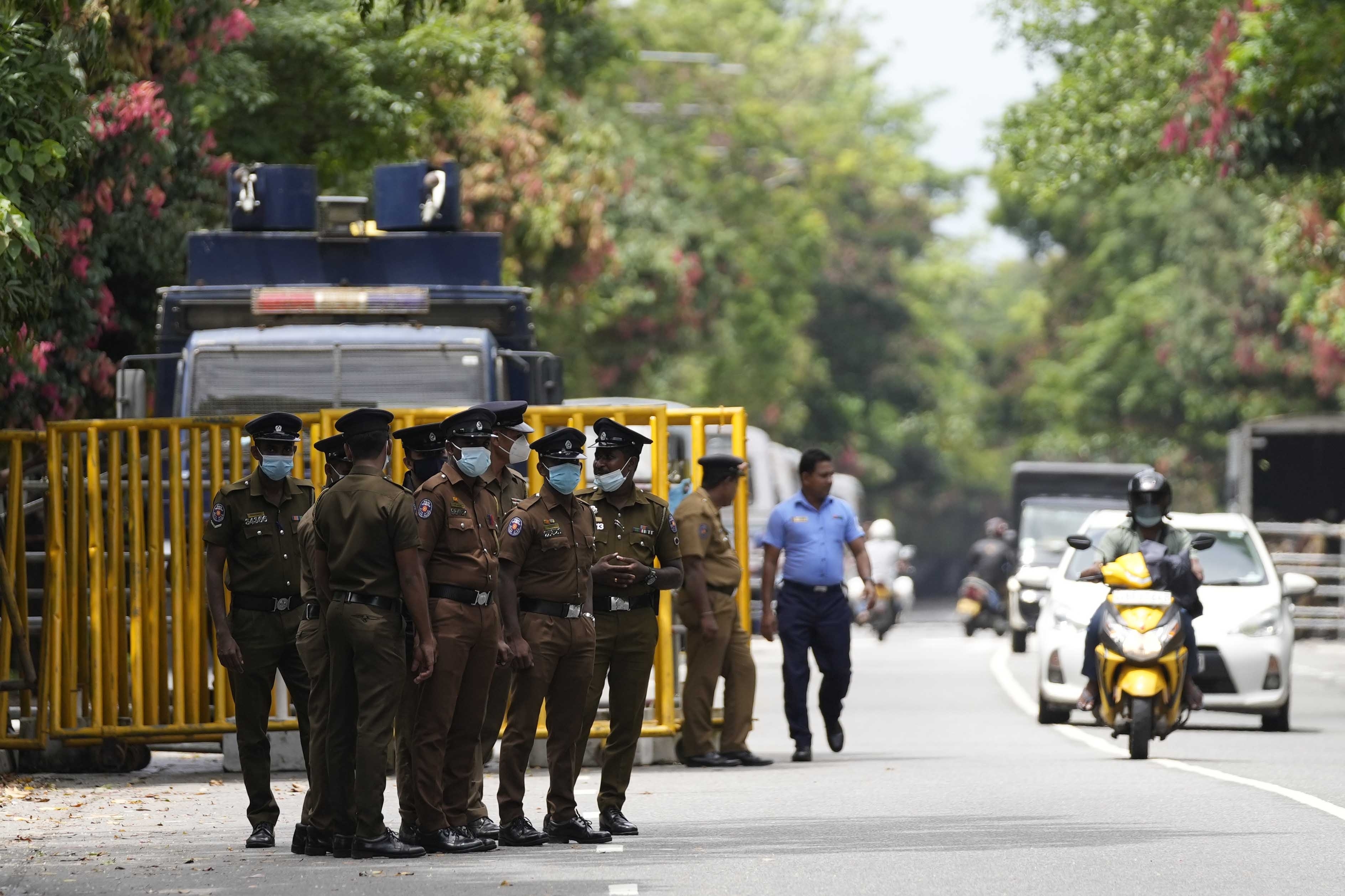 Police officers guard the entrance to the Sri Lankan parliament in Colombo