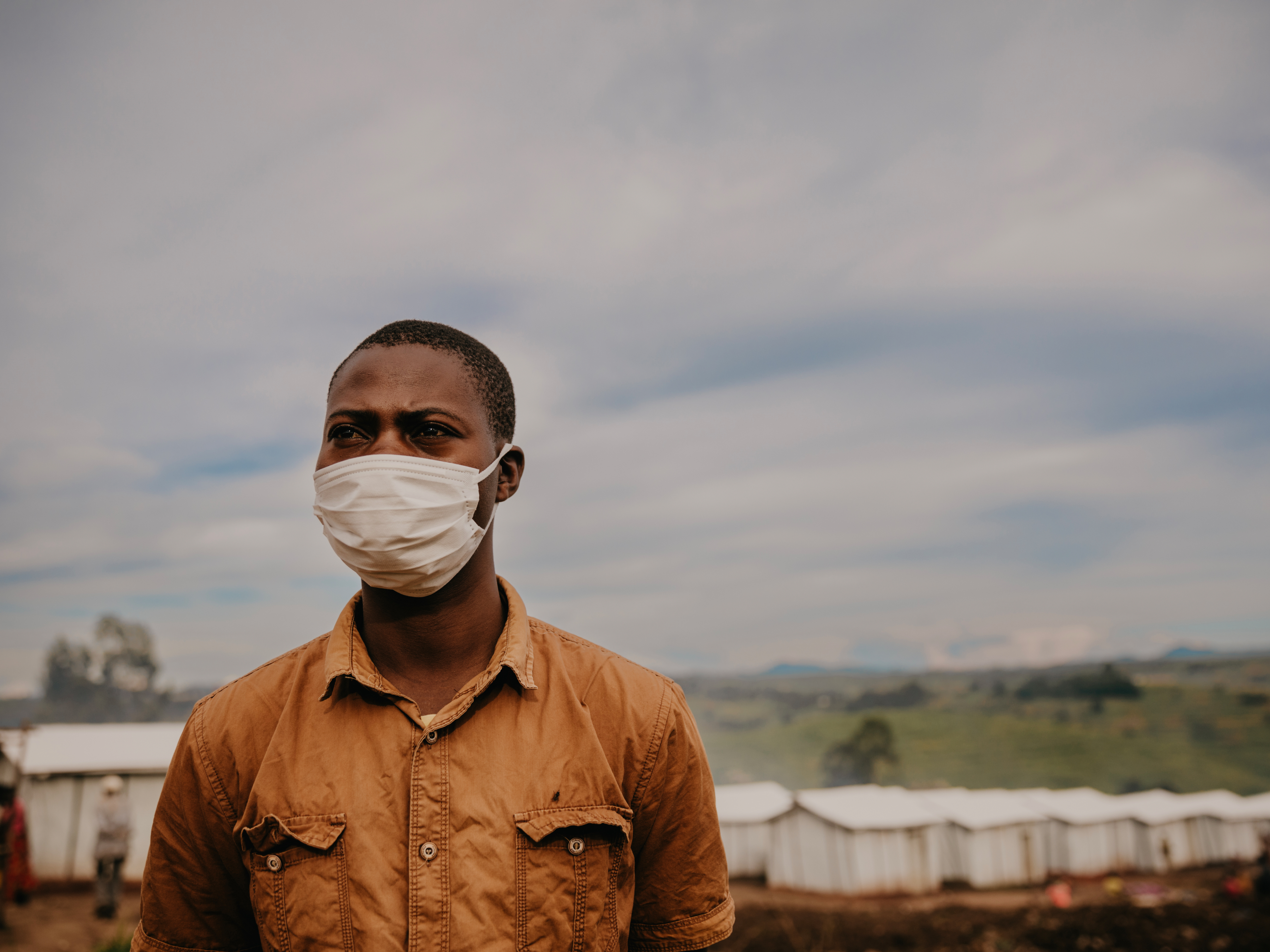Health worker Nelson* outside a small clinic where he tends to the medical needs of those living in Plaine Savo displacement camp. “So many of those living here have lost whole families. People find it hard to remain calm after the attack, and so many are traumatised.”