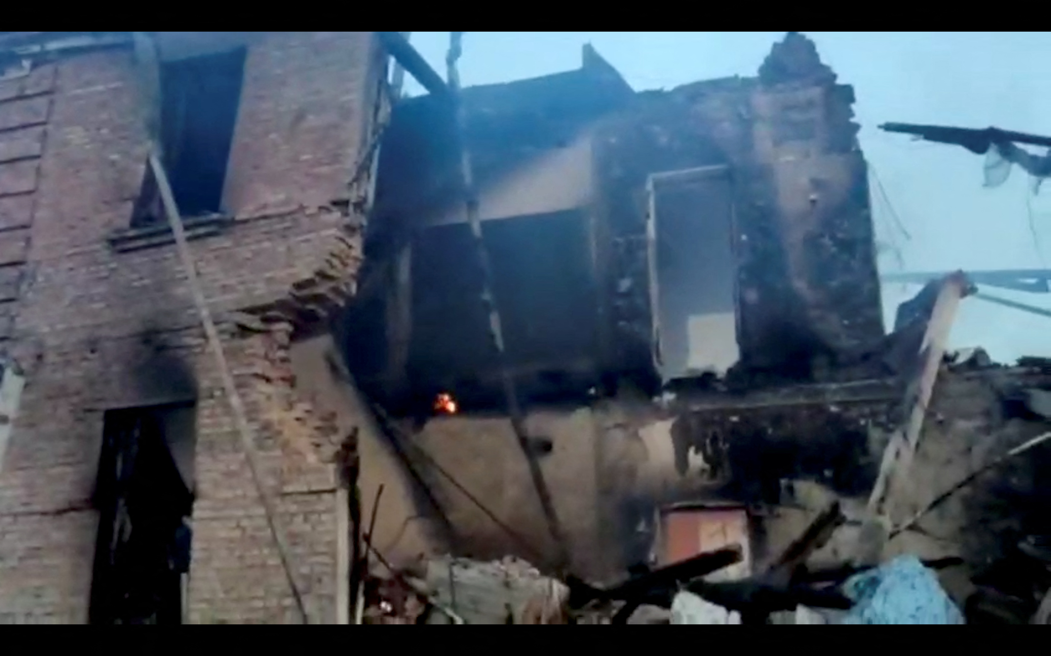 A partially collapsed school building in the village of Bilohorivka, Luhansk, Ukraine, May 8, 2022