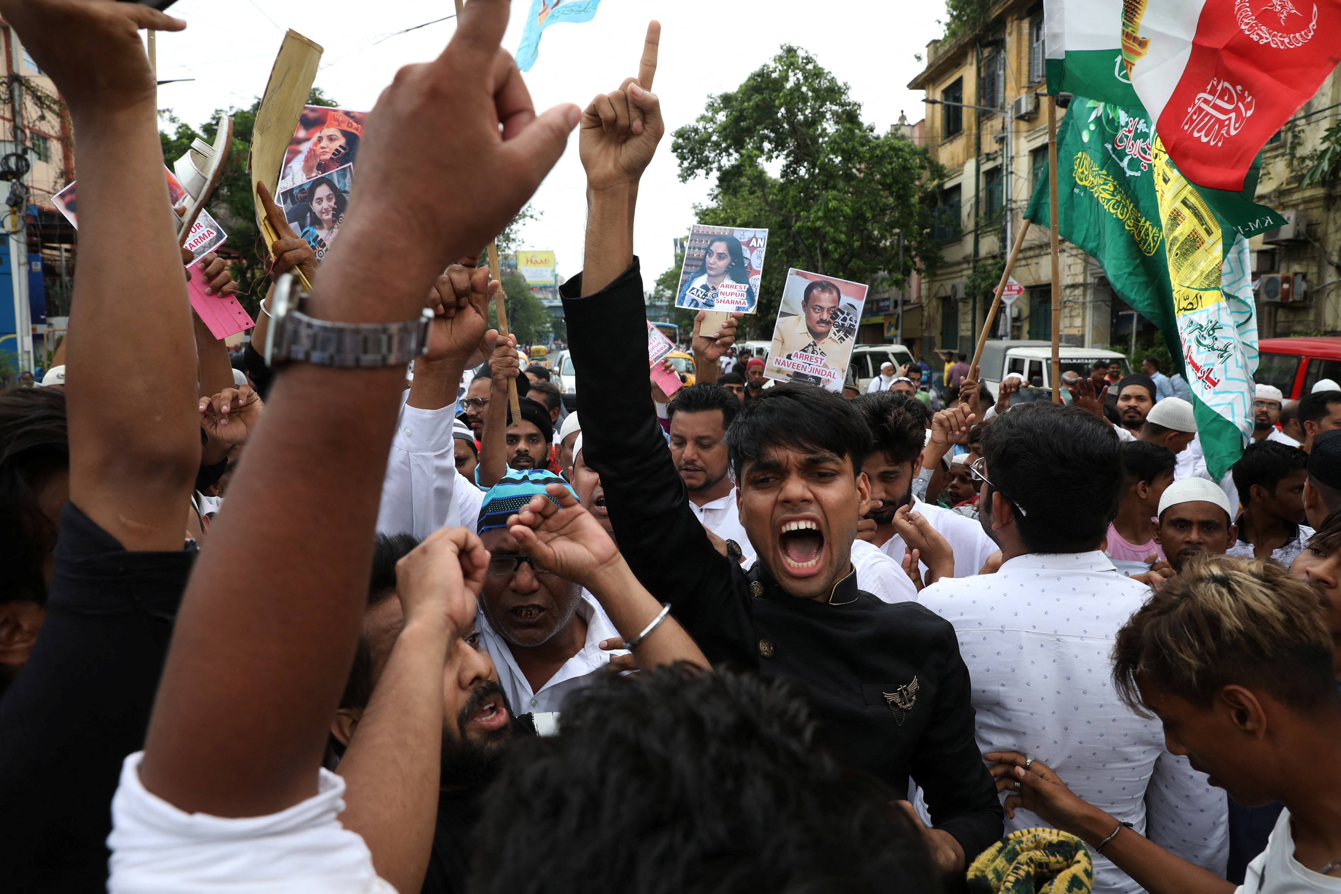 Muslims shout slogans during a protest demanding the arrest of Bharatiya Janata Party (BJP) member Nupur Sharma for her comments on Prophet Mohammed, in Kolkata