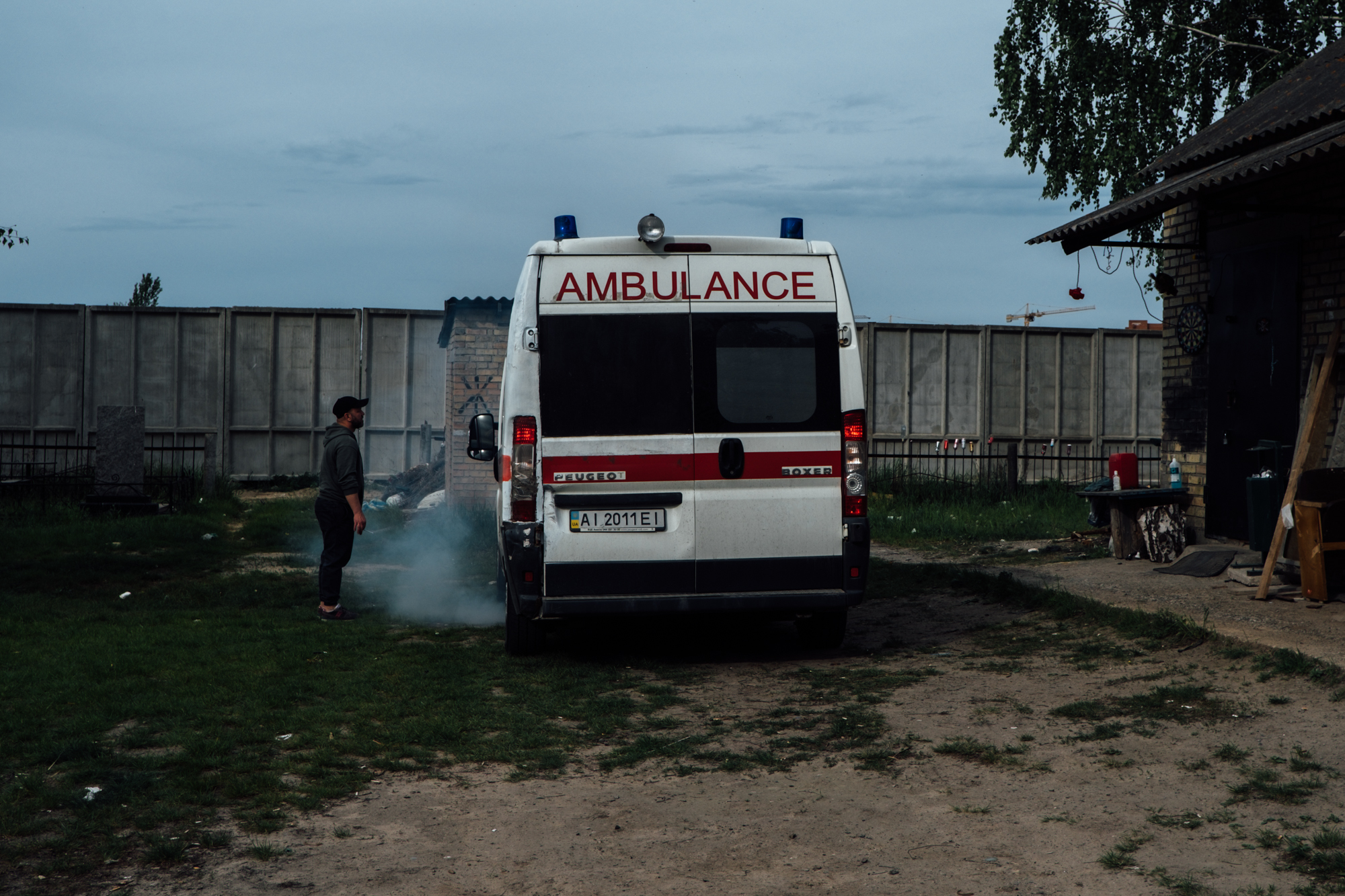 An old ambulance is used to transport dead bodies to the graveyard
