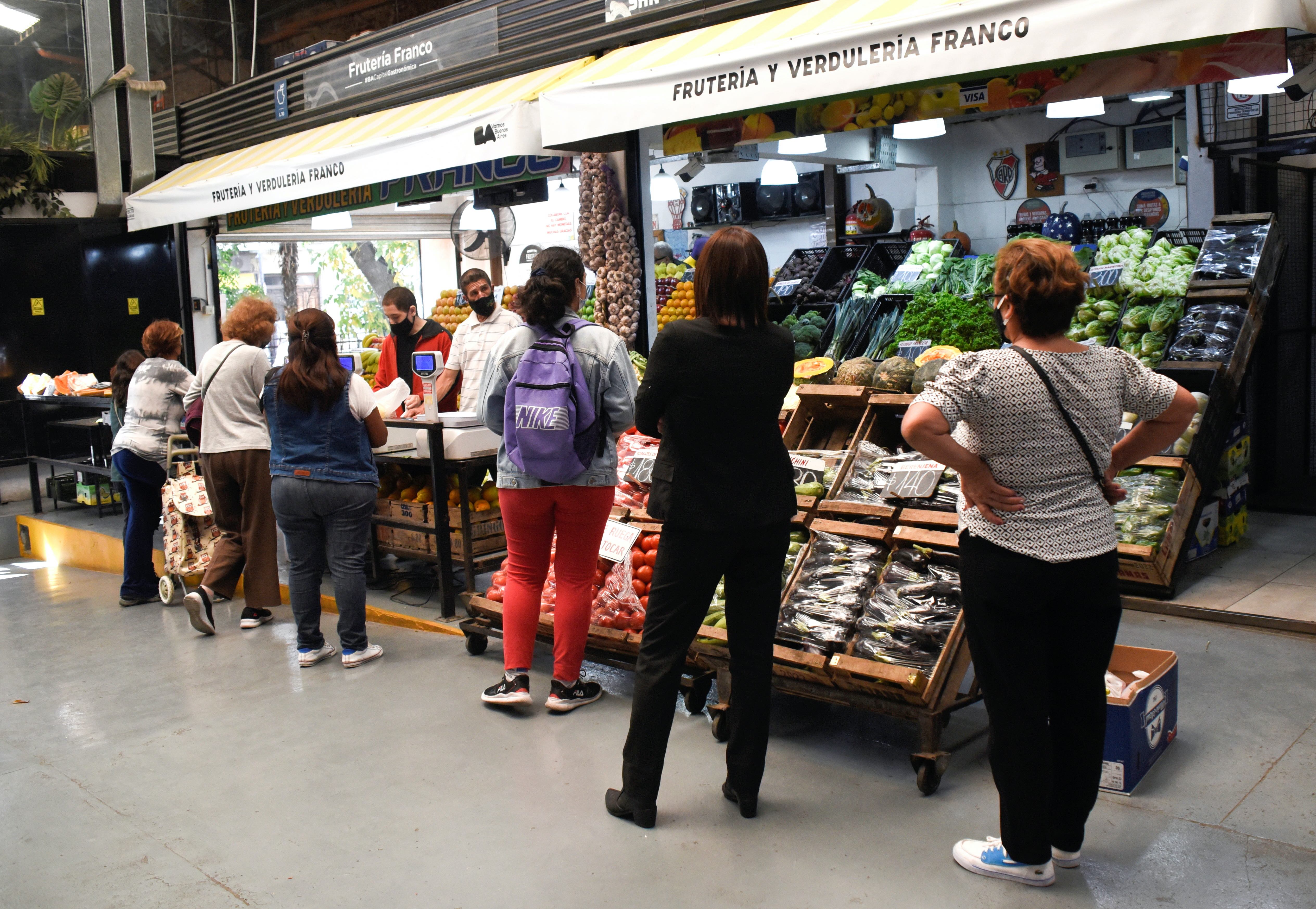 Customers line up to buy produce in a market as inflation in Argentina hits its highest level in years, causing food prices to spiral, in Buenos Aires, Argentina