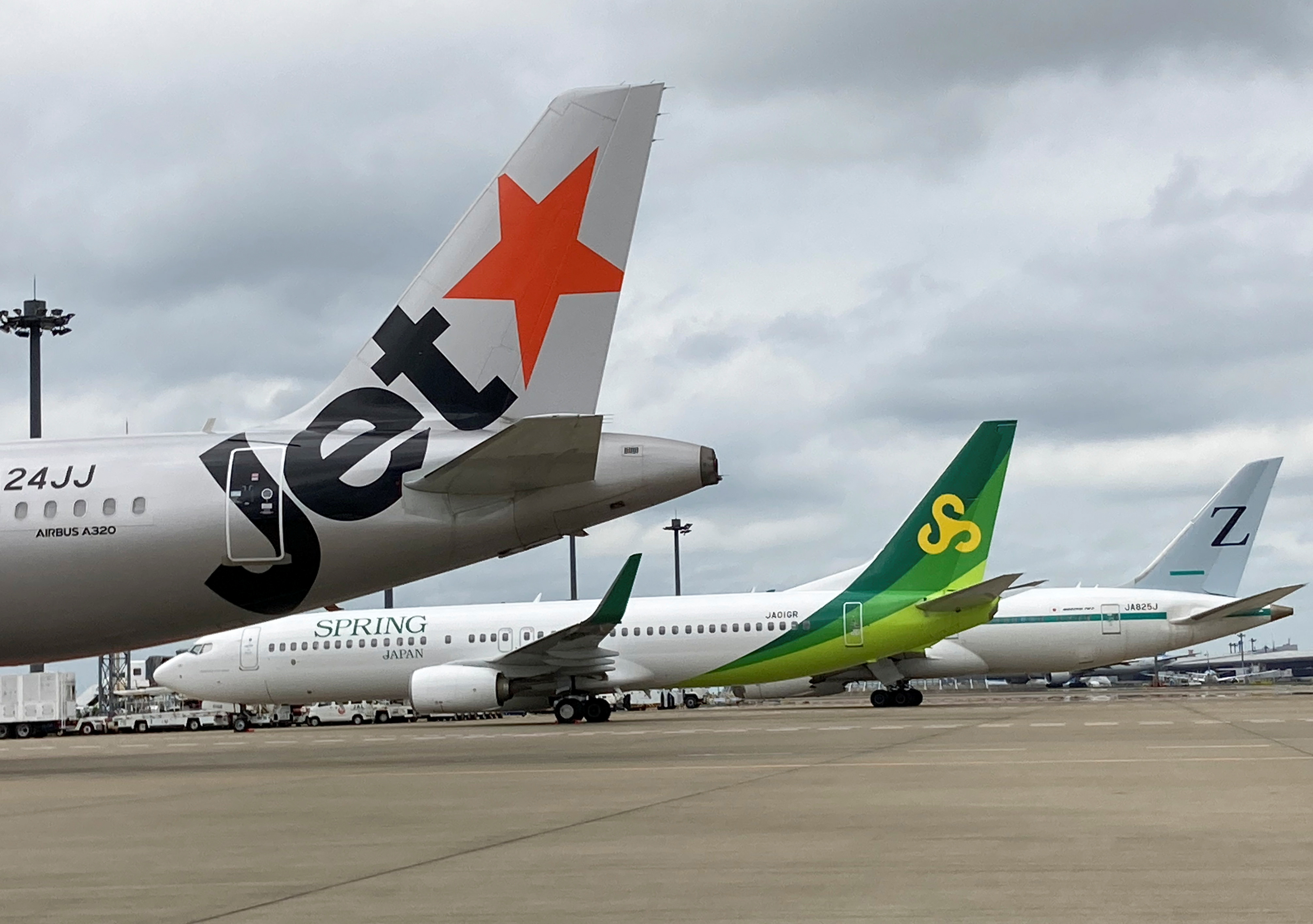 Jetstar Japan, Spring Japan and ZipAir aircraft at Narita international airport in Japan.