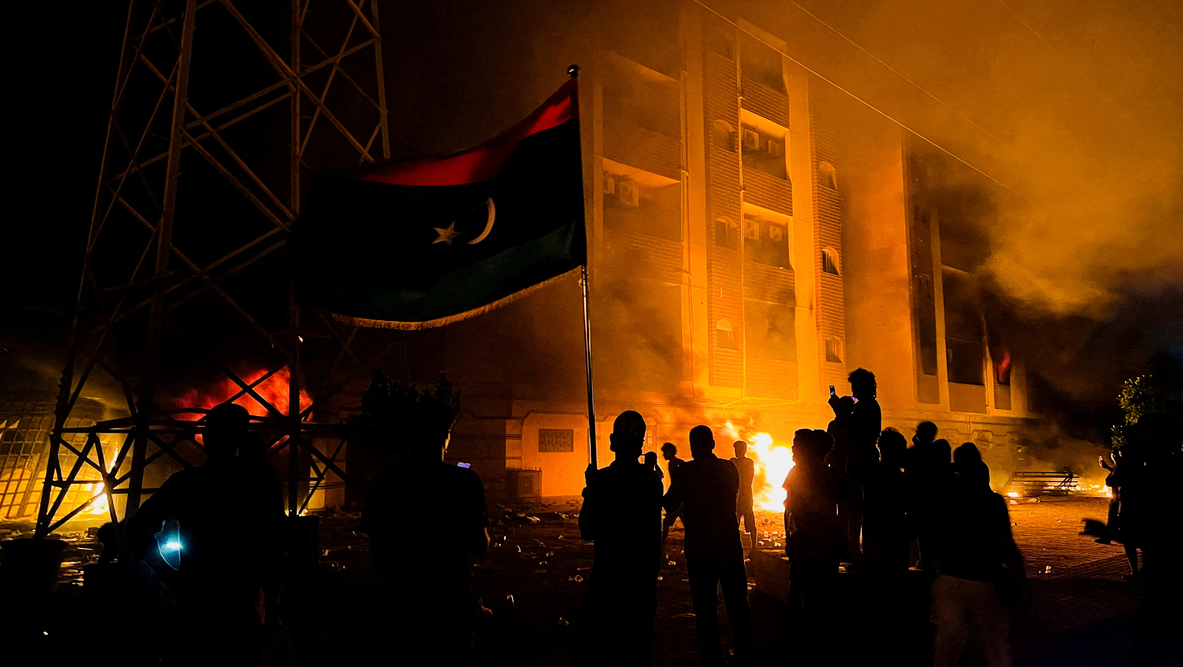 Protesters set fire to the Libyan parliament building after protests against the failure of the government in Tobruk, Libya July 1, 2022.