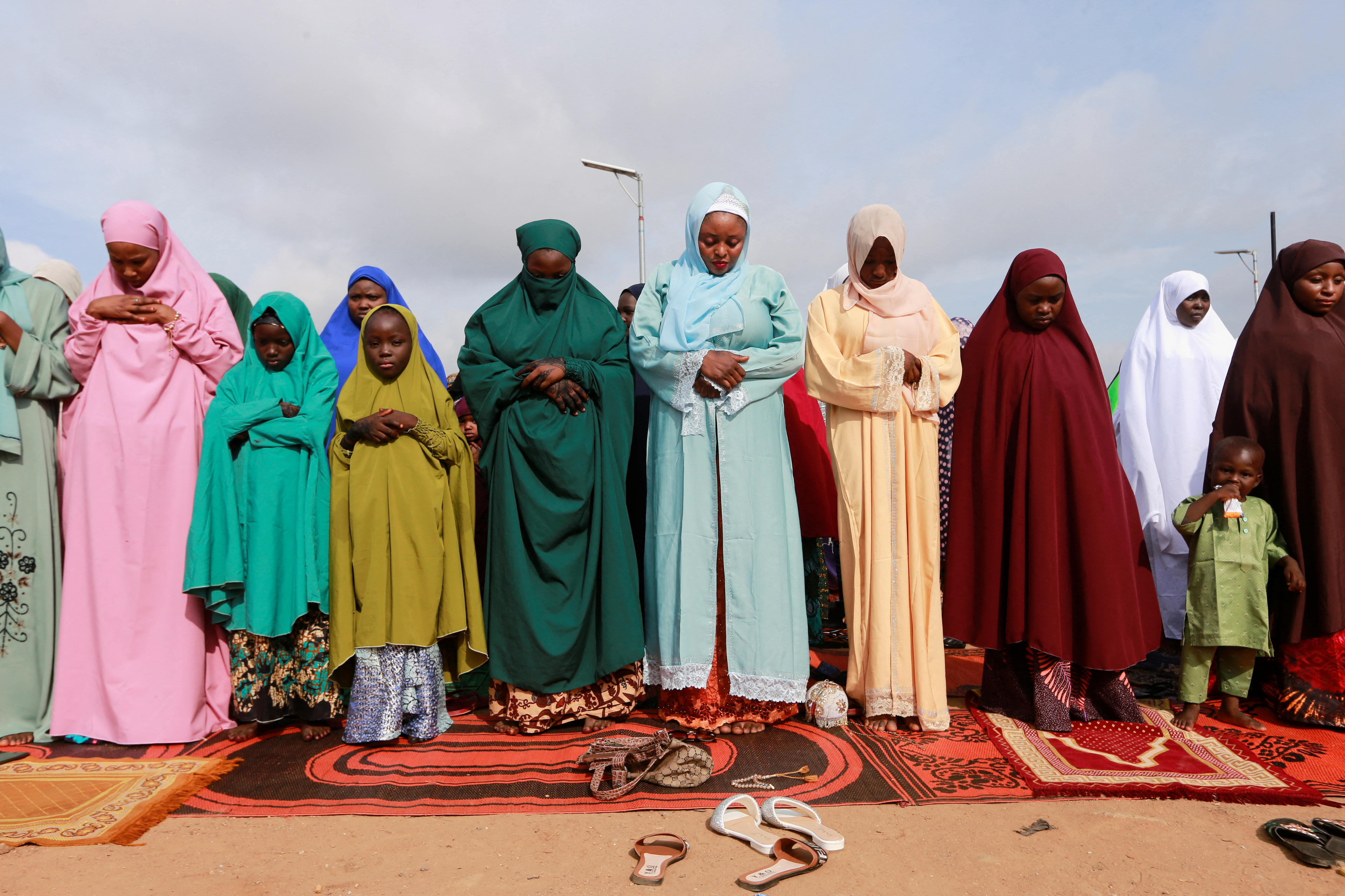 Muslim faithfuls pray during Eid al-Adha celebrations at Mabushi in Abuja, Nigeria