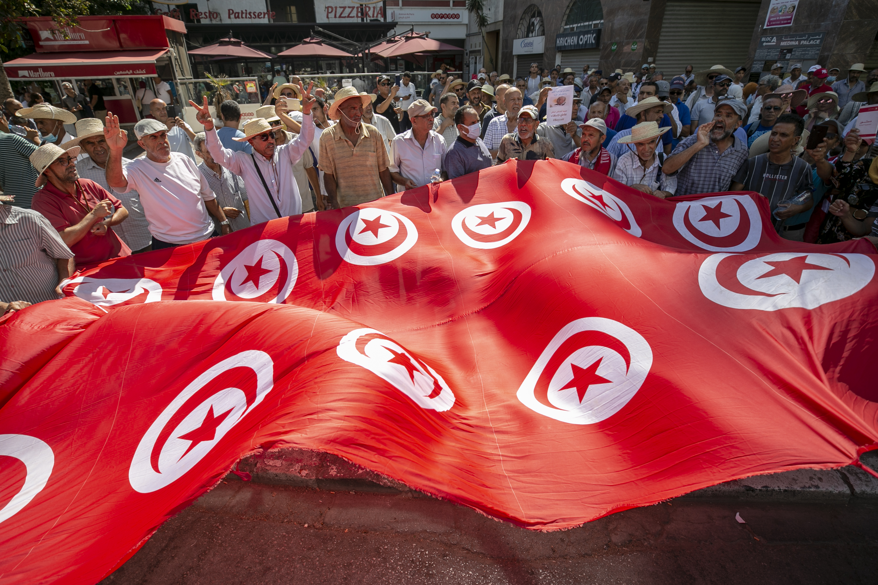 People gather at Habib Burgiba Avenue to stage a protest against the referendum