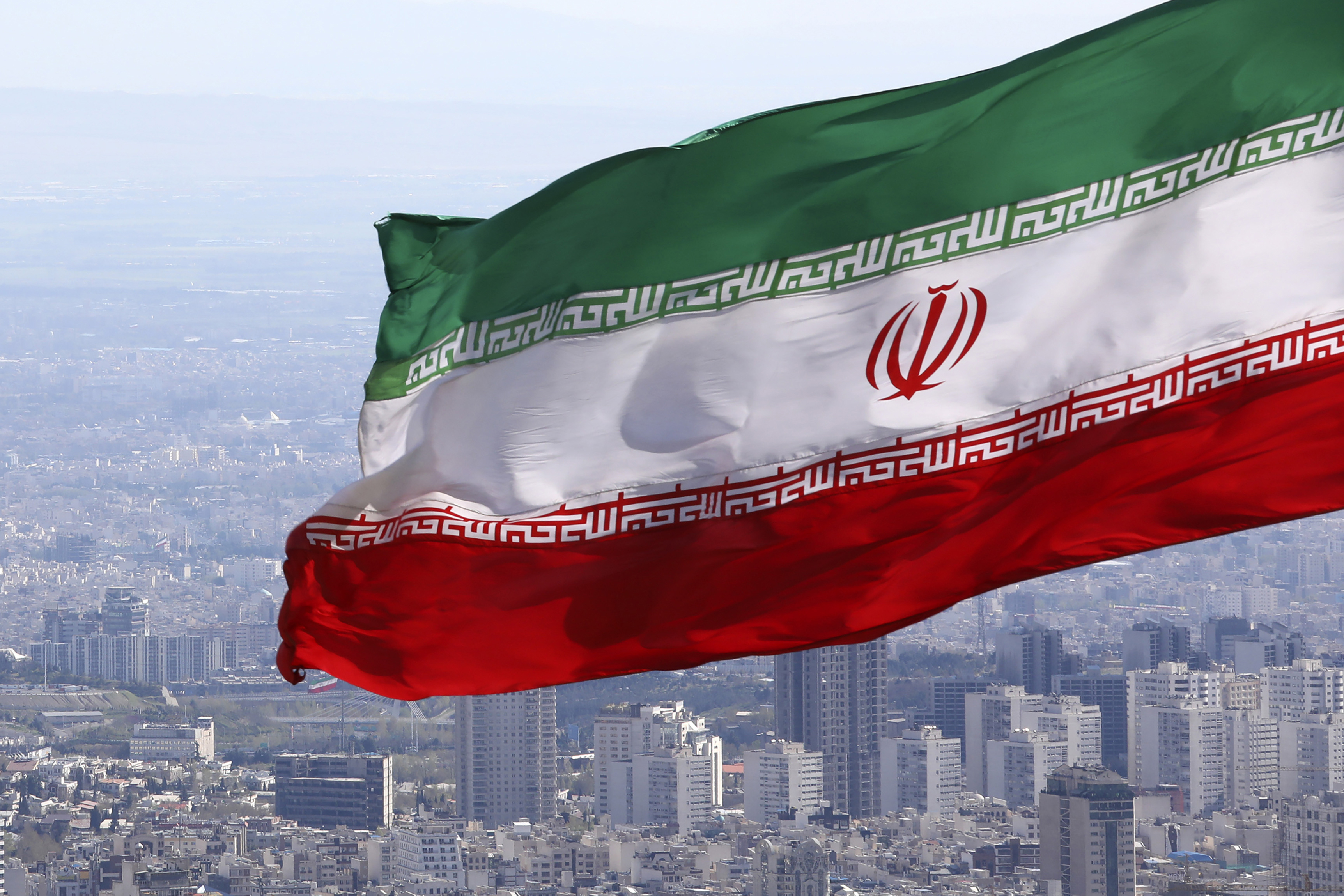 Iran flag flying over Tehran.