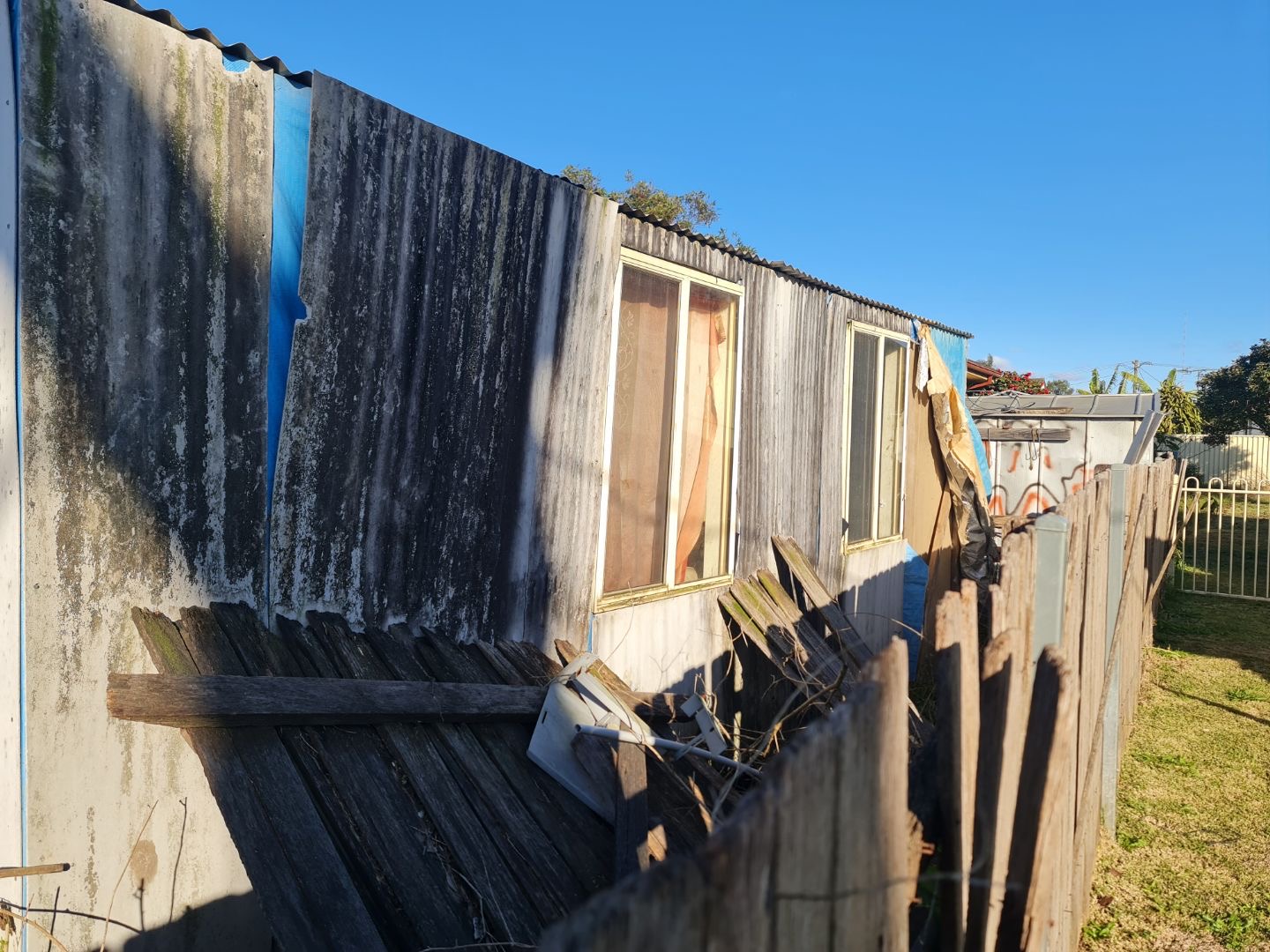 Zyrub's flat in the garden of his home is decaying and mouldy.