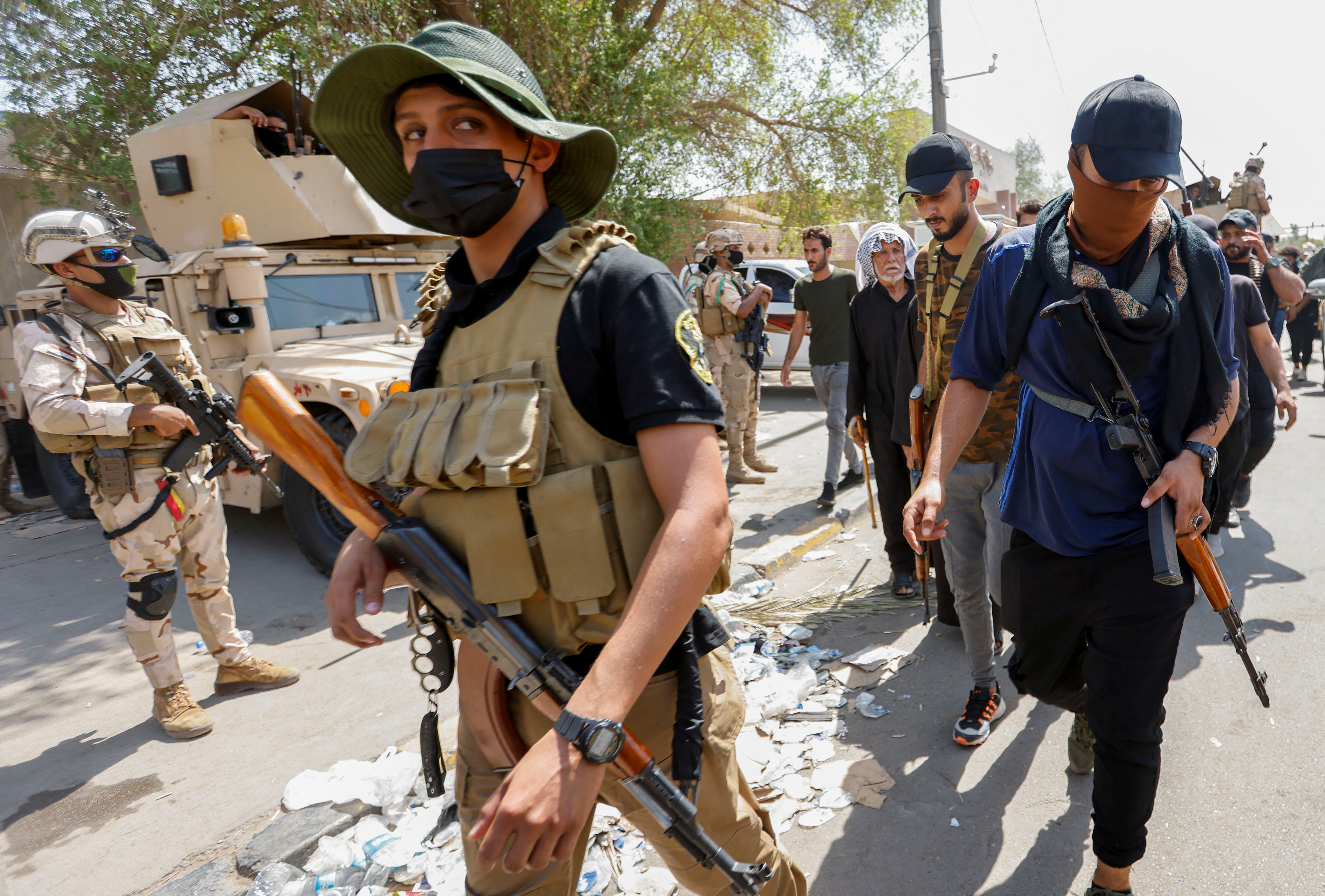 Followers of Shia leader Muqtada al-Sadr withdraw from the streets after violent clashes, near the Green Zone in Baghdad, Iraq.