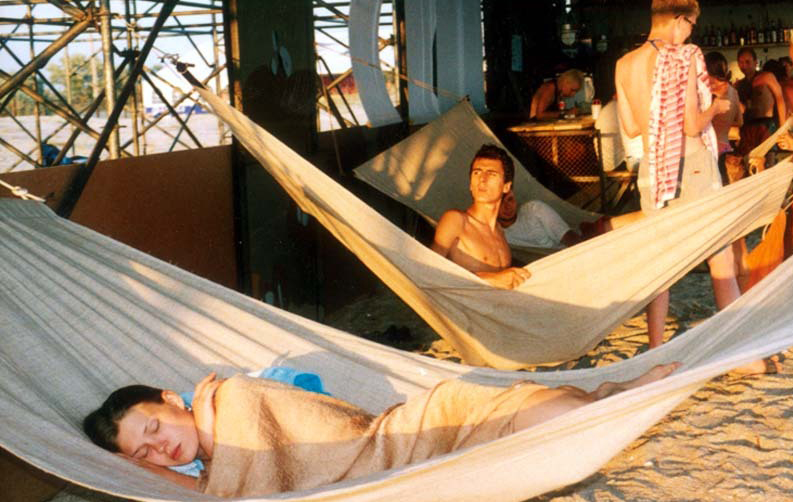 In 2002 people relax in hammocks at KaZantip. For former festivalgoers, it is difficult today to imagine such an event that unifies people across borders taking place [Natasha Kto Nado]