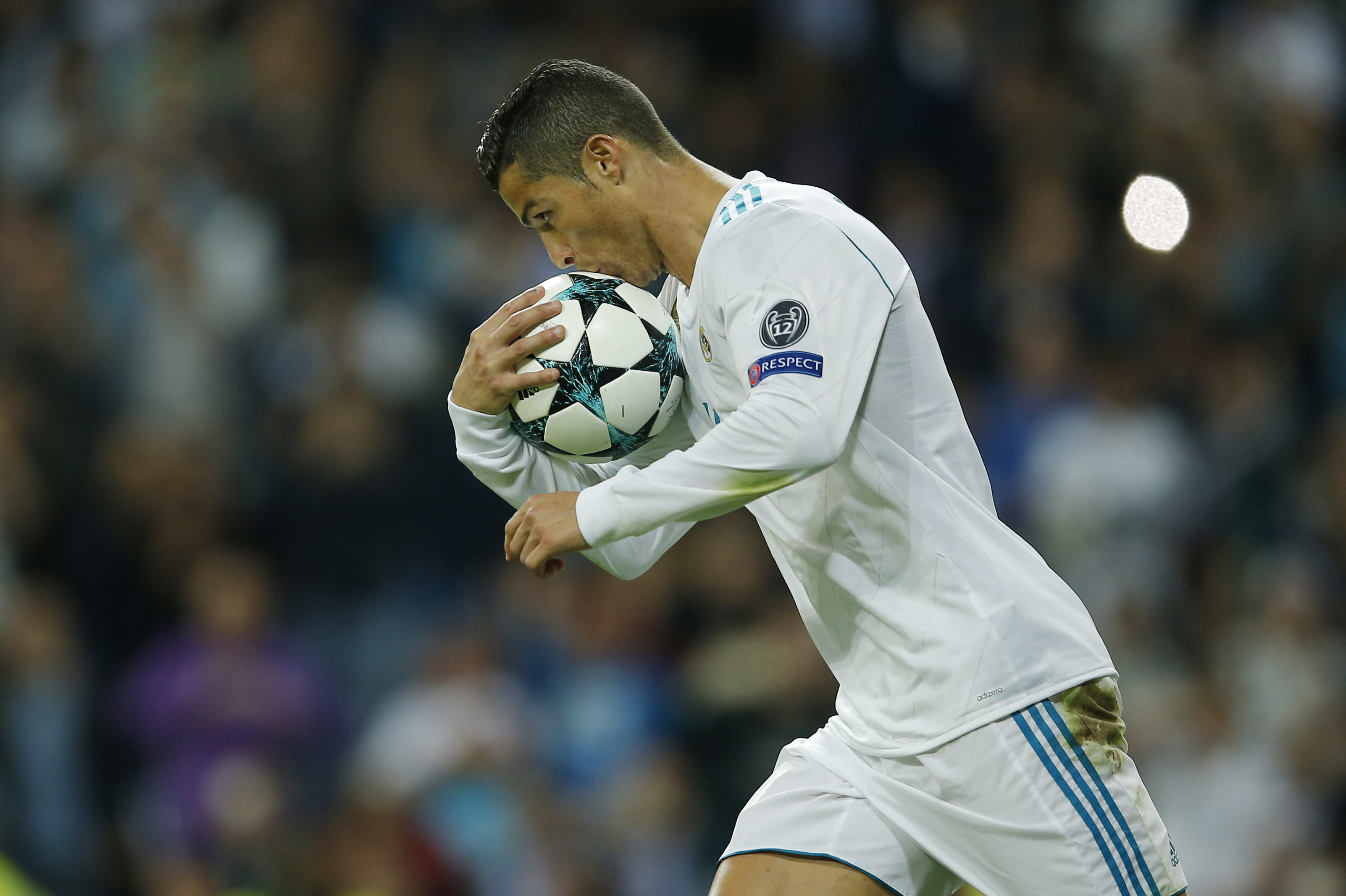 Real Madrids Cristiano Ronaldo jumps for the ball with Malmos Anton Tinnerholm during a Champions League group A soccer match between Real Madrid and Malmo at the Santiago Bernabeu stadium in Madrid, Tuesday, Dec. 8, 2015. (AP Photo/Daniel Ochoa de Olza)