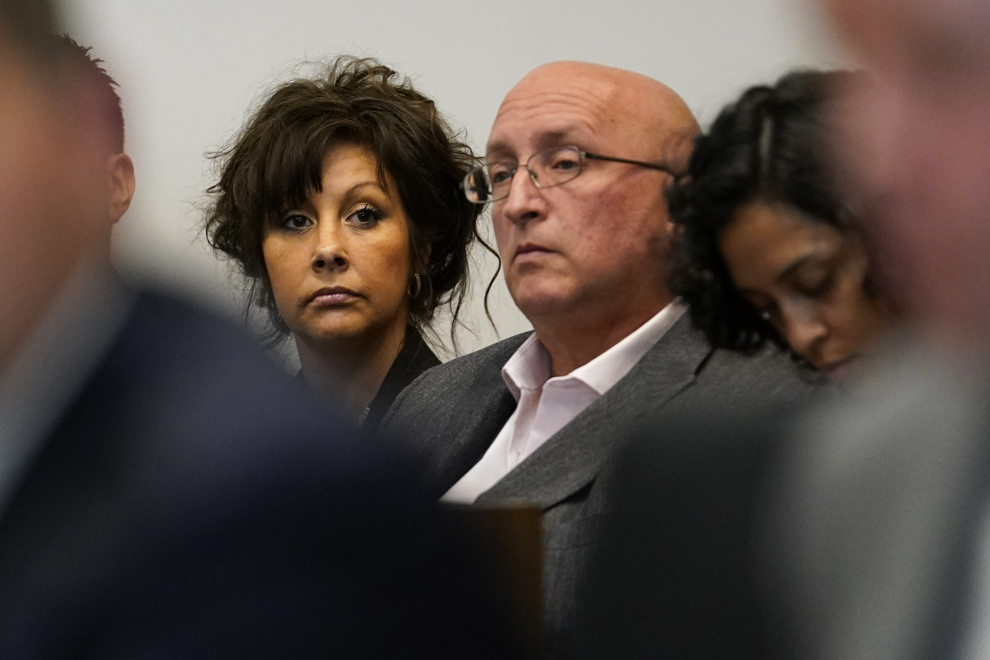 Robert E Crimo III’s mother Denise Pesina, left, and father Robert Crimo Jr, centre, attended the hearing on Wednesday
