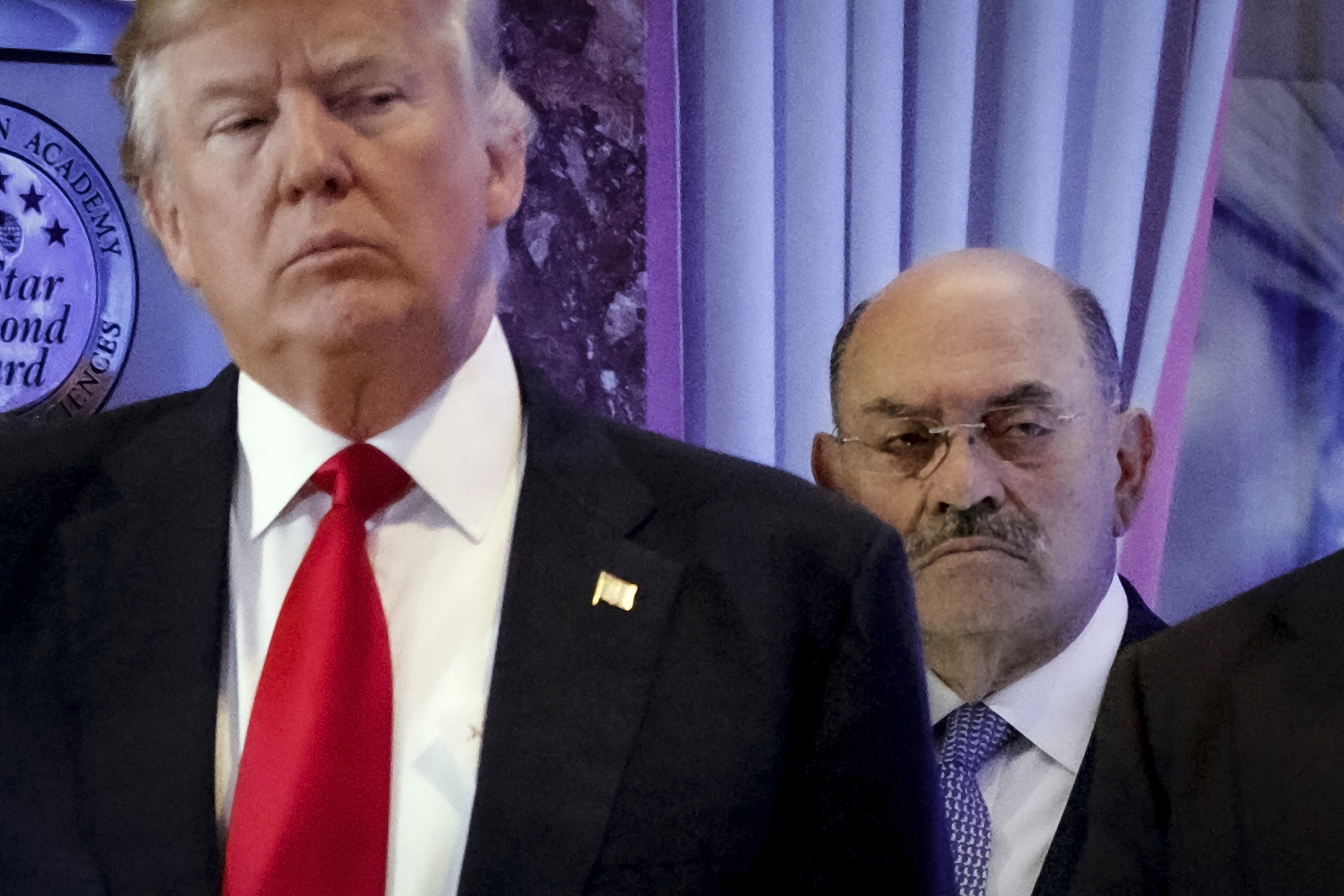 Allen Weisselberg, right, stands behind then President-elect Donald Trump