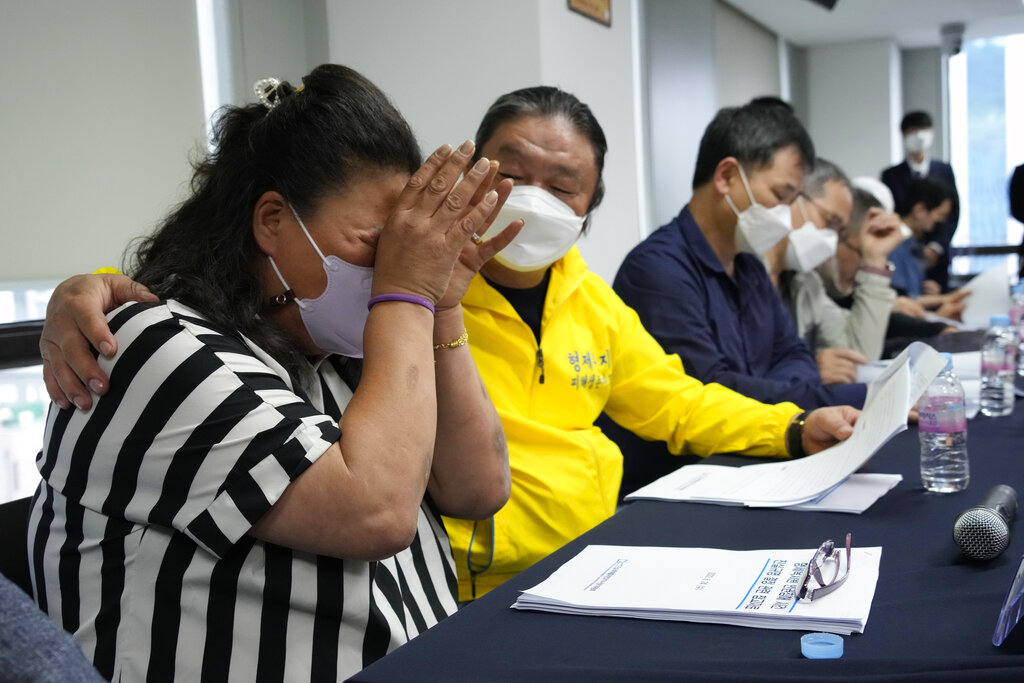 Park Sun-yi, left, a victim of Brothers Home, weeps during a news conference at the Truth and Reconciliation Commission office in Seoul, South Korea, on August 24, 2022