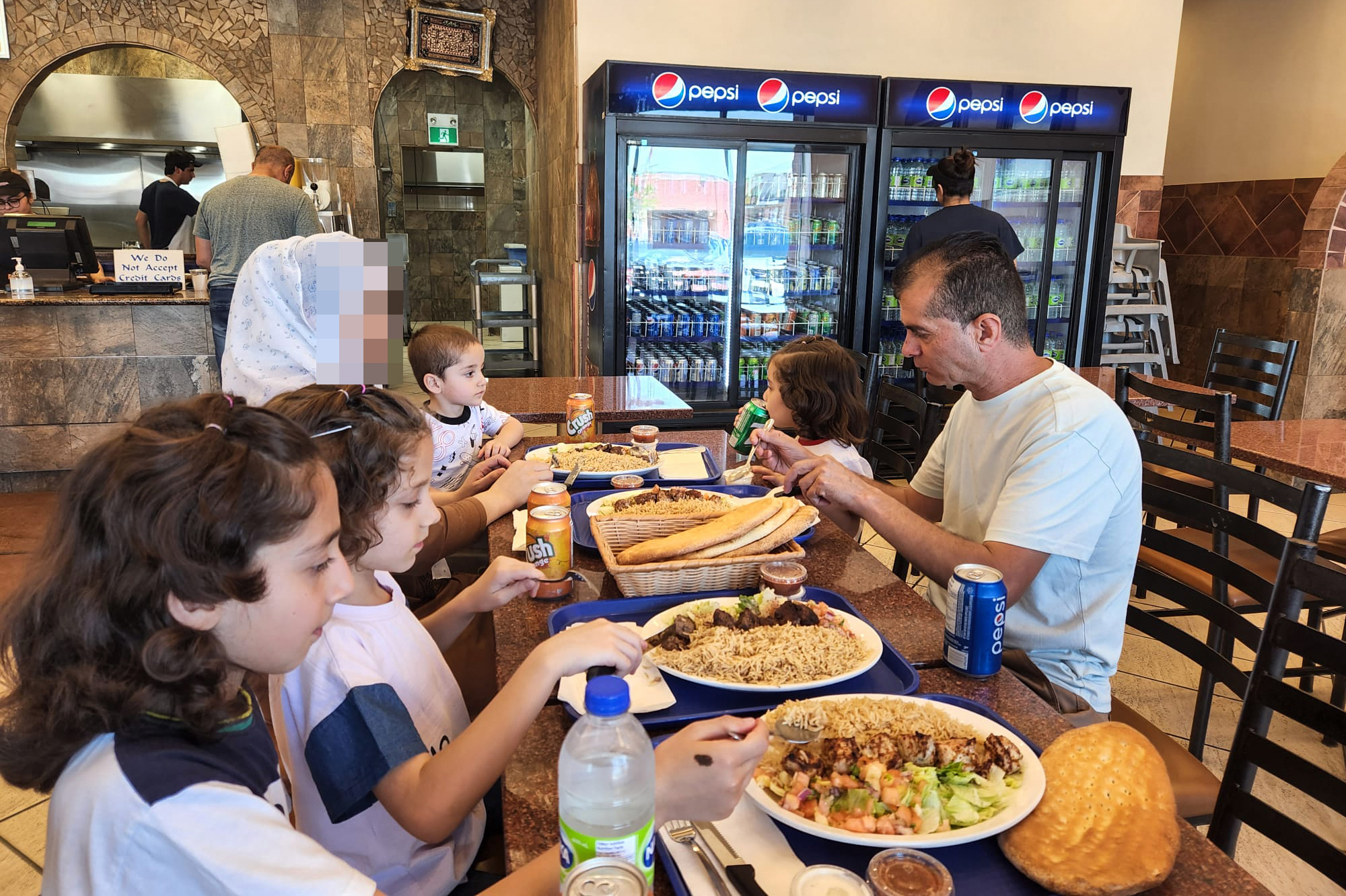 During the reunion, the group enjoyed a quiet naan and kebab lunch at an Afghan restaurant in Toronto [Courtesy of Mina Sharif]